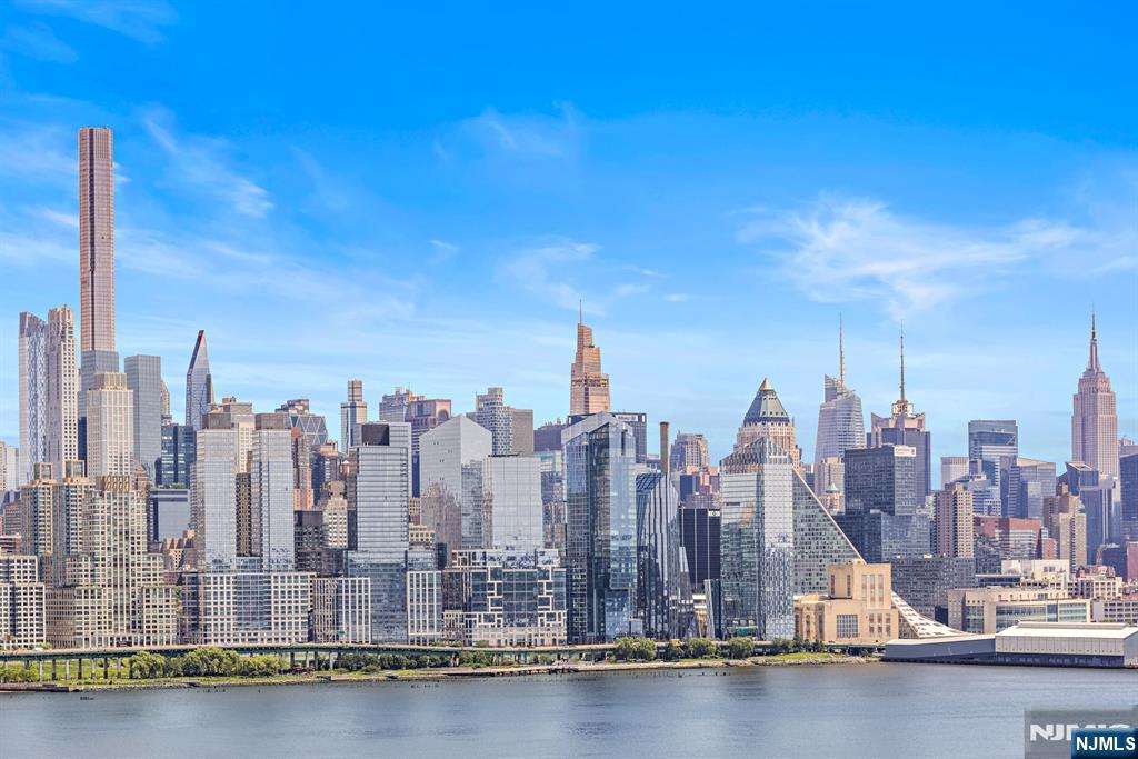Rarely available 3-bedroom, 2-bath corner residence offering approximately 1,850 sq. ft. of living space and a 300 sq. ft. private terrace with sweeping, unobstructed Manhattan skyline and Hudson River views. A remarkable value at this price point, this expansive home offers oversized rooms, an open kitchen, abundant natural light from three exposures, and a spacious primary suite with custom walk-in closet and en-suite bath. Located along Boulevard East with convenient access to Midtown Manhattan, this full-service building offers 24-hour concierge, valet, fitness center, pool, and on-site parking (fee). Maintenance includes property taxes, utilities, internet, and pool accessâ€”providing exceptional value compared to many condominium alternatives. Some photos have been virtually staged.