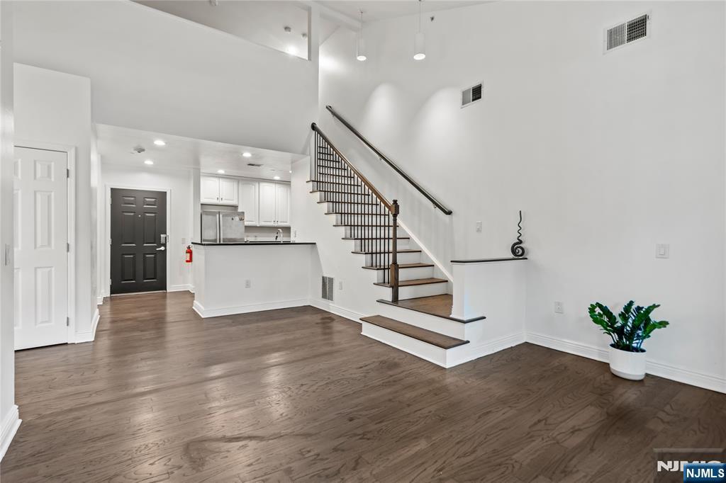 Welcome home to this top floor 3 bed 3 bath duplex premier waterfront building located at Hudson Pointe. This duplex home stretches across approx. 1383 sqft. The gourmet kitchen includes beautiful cabinetry, stainless steel appliances & granite countertops which overlooks the living room featuring a balcony. The master suite has an expansive walk-in closet & modern master bath. The second bedroom is very spacious with big windows, the top floor has a 3rd room that allows for flexible living options where it can be used as an office or a 3rd bedroom. The amenities include a 24hr doorman, fitness center, business center, cinema room & a pool. Enjoy the convenience of two car indoor parking(1 assigned & 1 floating) which is very rare! Easy access to NYC with NJ Transit, you don't want to miss this one!