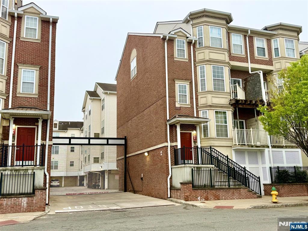 Spacious Dartmouth unit w 1420 SF. Refrigerator, Dishwasher, Washer, Dryer & Microwave included. Maximum occupancy: 4. LR: 14'x16', DR: 10'X12'4, Kitchen: 9'X10'10, BRS: 12'x14'2 & 15'2x14'. Loft: 13'8x8'11. Hardwood floors on 1st level & stairs from entrance to living room. w/w carpeting on 2nd level. 2 Central Air & forced hot air heat replaced a couple of years ago. One for each level. 2-story high ceiling in dining room. Pull-down stairs to an attic for storage & HVAC systems. 1 garage plus 1 covered parking space outside the garage included. Flood insurance covered by HOA fees. Security Deposit:1.5 months. Tenant to pay all utilities including water & sewer. Walk to Harrison Path Station in 13 minutes. Good credit required. Close to Rt. 280, Rt. 21, NJPAC, Prudential Center, NJIT & Rutgers. Available to occupy on 7/1/26. No pets, no loud music & no smoking in or near the apartment. Tenant to pay $250 move-in fee & 200 refundable moving deposit & renter's insurance required by the condo association. Balconies in entire community cannot be opened or used. Access to gym/clubhouse/pool & shuttle to path requires annual membership fees paid duing open enrollment every November. Unit door is facing East. Attached photos were taken before current tenants moved in.