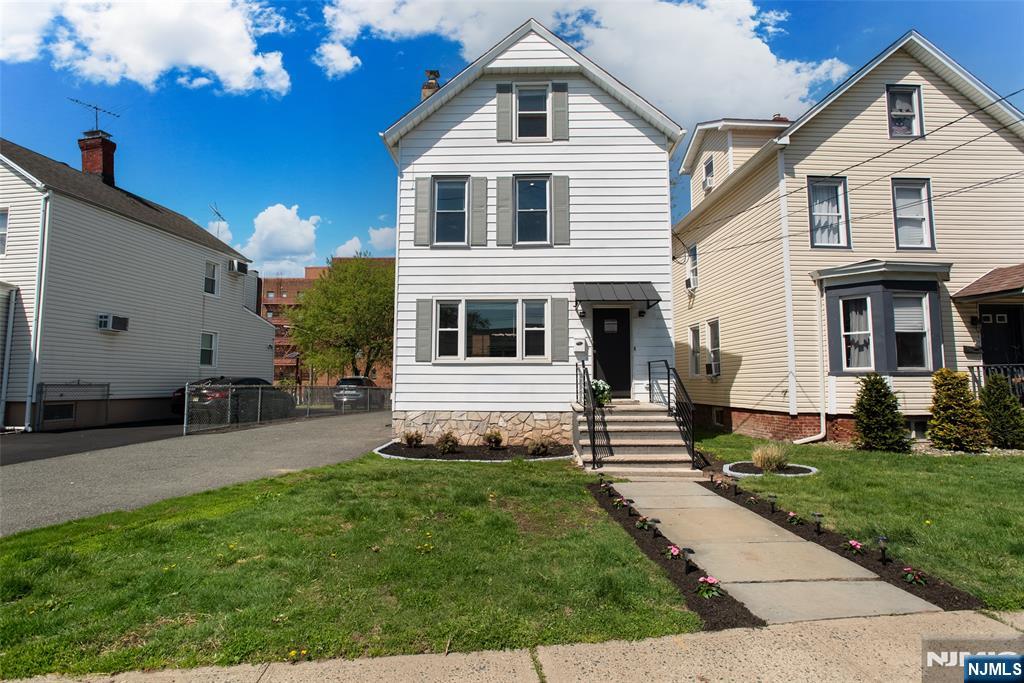 Turn-of-the-century charm meets modern flair in this renovated 4 bed/2.5 bath Colonial that's literally a 3 minute walk to downtown Bloomfield, mid-town direct/ Hoboken trains, shopping and restaurants! Feast your senses as you step onto the newly designed front stoop w/ sleek modern handrails and awning, new landscaping & lights. The 1st floor has bright sunny windows, original ribbon-inlay HW floors, tall ceilings and modern updates throughout. New lighting in the entry hall, LR, DR, EIK (all new SS appliances!) PR, and Laundry Room. Head upstairs to the 2nd floor where you'll find a newly updated main hall bath w/ penny tile and floating vanity. 3 well-proportioned BRs and large handy WIC in the hall. The 3rd floor features office/rec area w/ vaulted ceilings, full bath w/ new glass shower door and spacious 4th BR. Freshly painted basement has great space for extra storage. A beautiful (and tranquil) deck off the back allows for morning coffee, an iced tea (or dining al fresco!), a 3/4 fenced yard w/ storage shed, and off-street parking for 3-4 cars. Upgraded 200 AMP electrical panel & rear roof re-done are some of the many upgrades you'll discover. Stroll down to Anthony's Cheesecake, Wings n Burger, or Bloomfield Steak & Seafood and Hometown Arcade for summer dining and fun! Don't miss this one!!