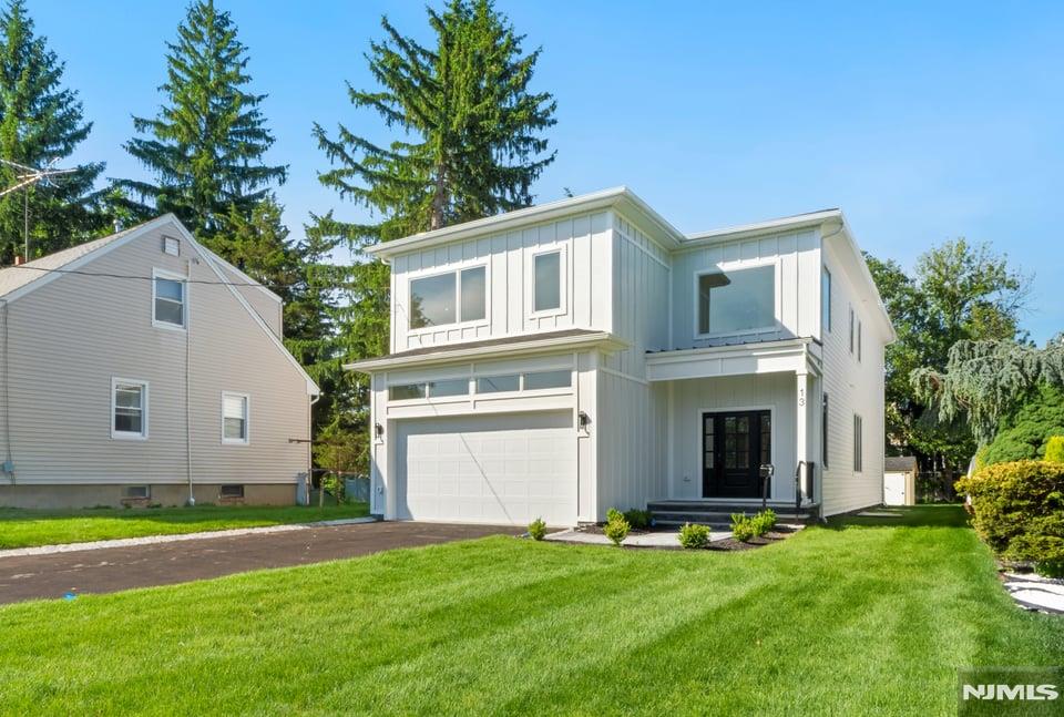 Exceptional new construction opportunity in Livingston's highly sought-after Riker Hill section. Offering approximately 4,500 square feet of thoughtfully designed living space, this 6-bedroom, 5.5-bath residence blends modern luxury, quality craftsmanship, and the unique opportunity to personalize select finishes and design elements while construction is underway. A grand foyer welcomes you into a bright, open-concept floor plan designed for both everyday living and entertaining. The heart of the home is a custom kitchen featuring premium appliances, abundant storage, and seamless flow into the main living and dining areas. A first-floor en-suite bedroom provides flexibility for guests, while a mudroom, powder room, and direct access to the two-car garage enhance convenience. The second level offers four spacious bedrooms, including an elegant primary suite with a spa-inspired bath, along with additional well-appointed bathrooms and a dedicated laundry room. The finished lower level expands the home's versatility with an additional bedroom, full bath, and flexible recreation, fitness, office, or media space. Outside, the property offers ample space for outdoor enjoyment and entertaining. Conveniently located near shopping, dining, parks, recreation, and major transportation routes, this exceptional home combines luxury, functionality, and location. Includes a 10-year new construction warranty.