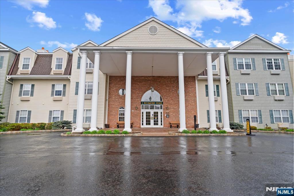 Welcome to this inviting Williamsburg model located in the sought-after Bald Eagle Commons, a vibrant 55+ community set among the picturesque hills of West Milford, NJ. Offering approximately 1,581 square feet of well-designed living space, this spacious unit features 2 generously sized bedrooms and 2 full bathrooms, providing both comfort and functionality for everyday living and hosting guests. Step inside to a bright and airy open-concept layout filled with natural light. The expansive living and dining areas create a seamless flow, ideal for relaxing or entertaining, while the kitchen offers ample cabinetry and counter space for easy meal preparation. The primary suite is a true retreat, complete with a walk-in closet and private en-suite bath. A second bedroom provides flexibility for guests, a home office, or additional living space. A rare and valuable feature of this unit is the prime parking spot conveniently located just steps from the front entrance, making daily living effortless. An assigned storage unit is also included, adding even more practicality. Enjoy the ease of low-maintenance living along with a wide range of community amenities, including a clubhouse, swimming pool, tennis courts, bocce ball, and scenic walking paths. Ideally located near shopping, dining, and recreational options, this home offers the perfect blend of comfort, convenience, and active adult living.