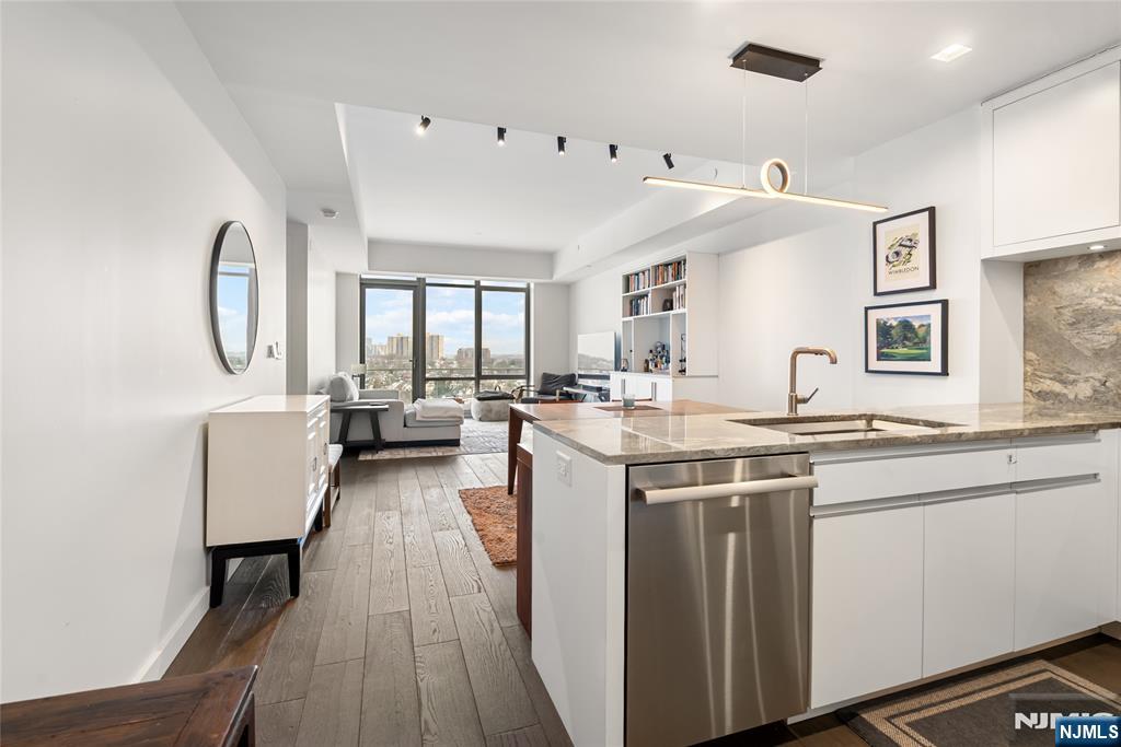 Penthouse-Level Living with Stunning River Views Experience elevated living in the largest one-bedroom residence at One Park, North New Jerseyâ€™s premier luxury condominium. This expansive 1-bedroom, 1.5-bath home showcases wide-plank white oak flooring, a private balcony with sweeping river views, custom-designed closets, and motorized blinds in the primary bedroom for added comfort and convenience. The thoughtfully designed open-concept layout is centered around a chef-inspired kitchen, complete with Thermador Pro Series appliances, elegant Cielo Quartzite countertops, custom cabinetry, and integrated lightingâ€”perfectly suited for both everyday living and sophisticated entertaining. Residents of One Park enjoy an exceptional collection of resort-style amenities, including an indoor heated pool, a rooftop deck with panoramic New York City skyline views, a state-of-the-art fitness center, golf simulator, basketball court, private home theater, guest suites, and 24/7 concierge service with shuttle transportation. This is a rare opportunity to own a penthouse-caliber one-bedroom offering luxury, comfort, and breathtaking views in one of the areaâ€™s most sought-after residences. Schedule your private tour today.