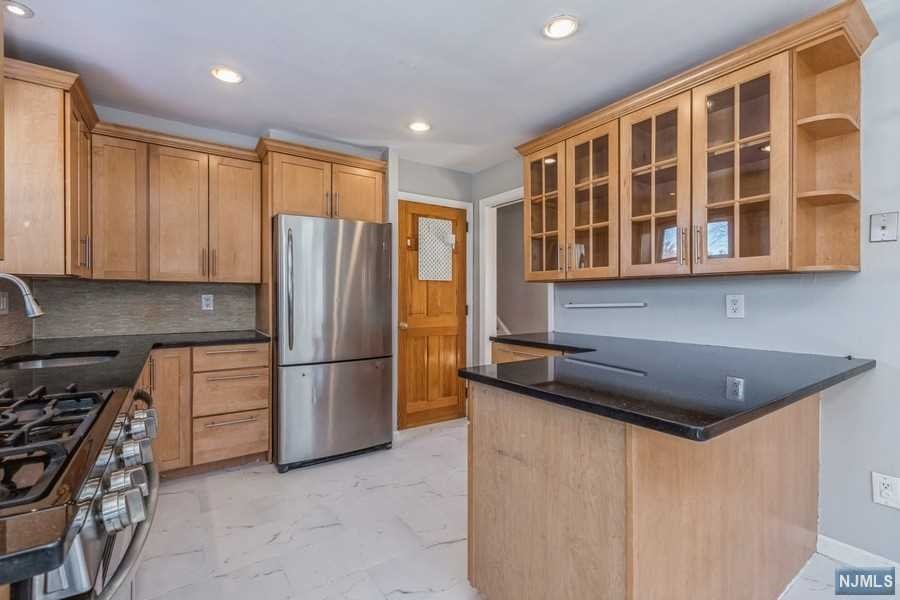 Spacious and Sunny Split-Level home sits on oversized lot of almost 1/2 acre. Modern Kitchen with Dining area features granite counters, SS appl and access to large deck. Newly refinished hardwood floors in living area. Second floor features 3 Bedrooms all generous in size and full bathroom with new vanity. Primary Bedroom has ensuite bath featuring glass-enclosed shower. Attic offers potential for expansion. Ground level has large family room, powder room and mudroom with access to rear patio and yard. Basement offers recreation room perfect for home gym or playroom and utility room for more storage. Well-cared backyard includes fenced garden for your own farm-to-table vegetable growing and 4-zone sprinkler system. Move-in ready home features 2 car detached garage, new roof, newer water heater and HVAC, recessed smart-home lighting and NEST thermostat. Incredibly located for convenient access to NYC Buses, close to Cresskill's Blue-Ribbon schools, parks, shopping and restaurants.