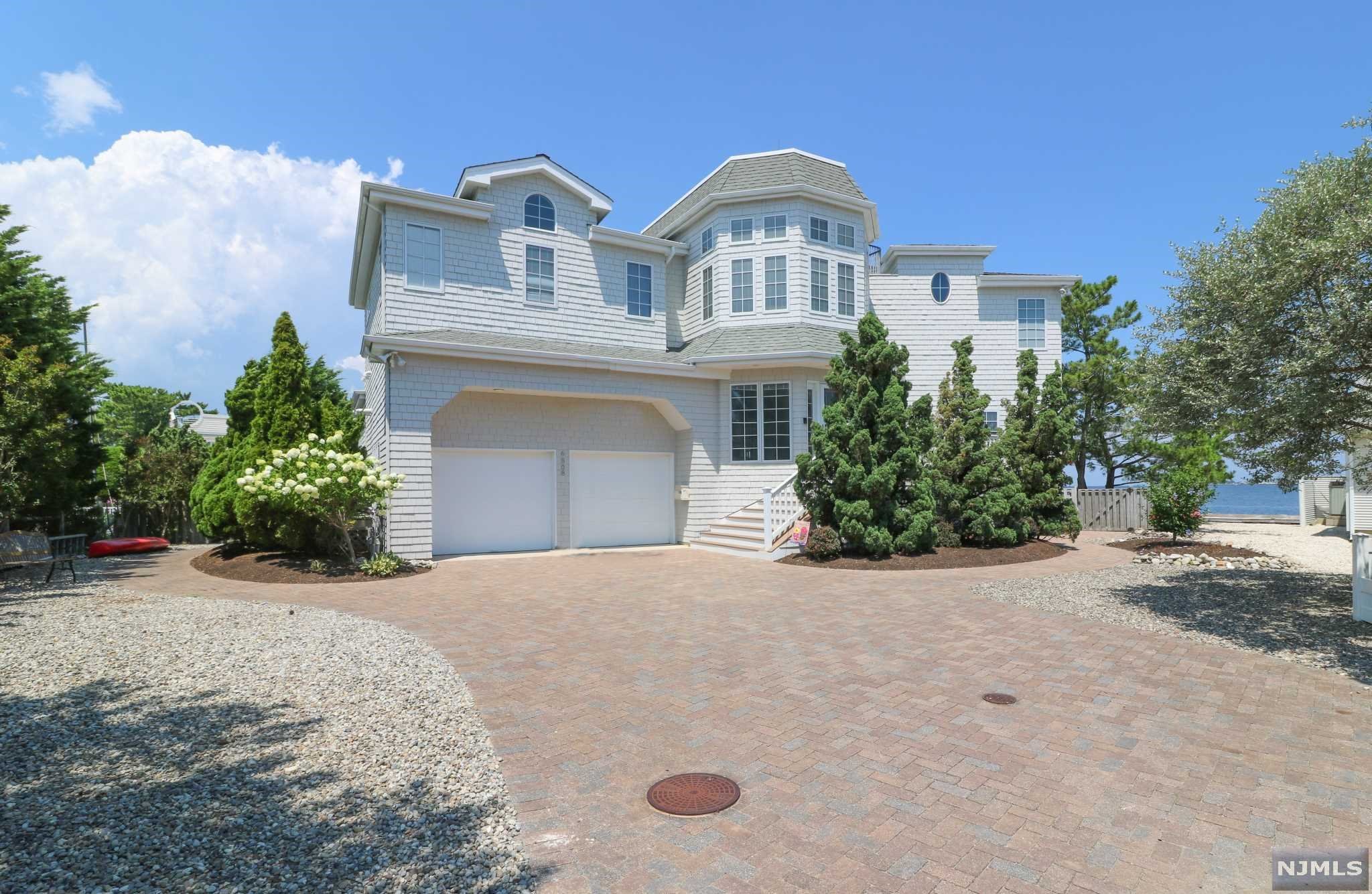finish off this floor. The main level offers a beautiful sunroom overlooking the bay, an in law suite with private bath, plus 3 additional bedrooms. Enjoy an easy walk to all things Harvey Cedars from6808 Suffolk! Shops, dining, market, coffee, liquor store, post office, bakery, and more! Look no further! This home offers both peace and pleasure! If you're looking for a special place to get away in a great neighborhood, this is it! Also listed on GSMLS and Bright MLS