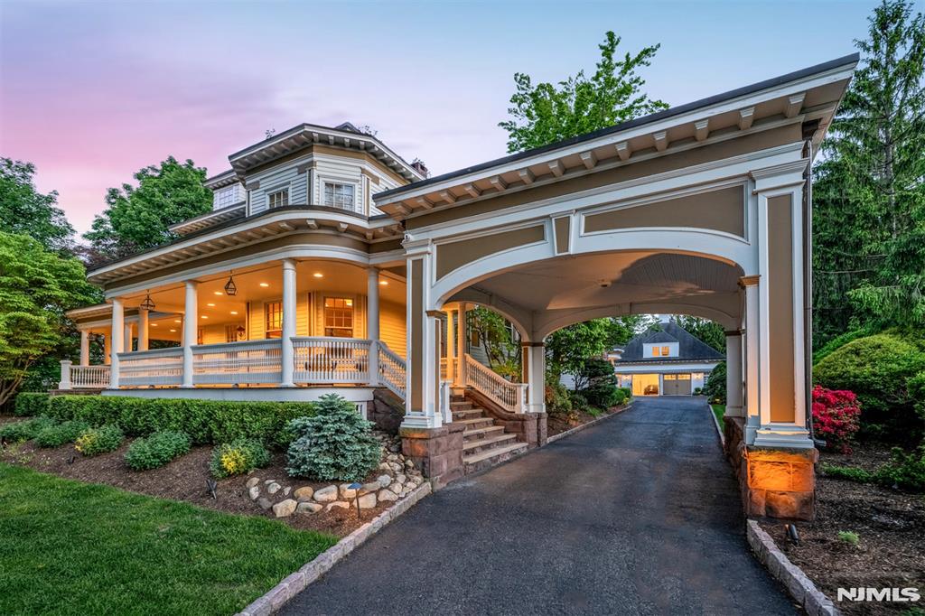 Incredible, iconic Ridgewood Victorian offering an expansive oversized floorplan filled with timeless charm and character. Completely renovated top-to-bottom with luxury upgrades throughout. It features 7 bedrooms and 9.5 bathrooms. Long driveway w. porte-cochere leads to oversized parking area & detached 4 car garage with basketball court, summer kitchen, pool bar, full bath. Stunning wraparound lemonade porch welcomes you. Gorgeous foyer with beautiful original details, stained glass windows, original pocket doors, and dramatic central staircase with gleaming piano black banister. Main level offers multiple FPs & formal sitting rooms, formal DR, home office, & extraordinary chefâ€™s kitchen serving as the heart of the home with professional Thermador appliances, oversized island, double sinks, double DWs, pantry, gorgeous ceiling detail, and seamlessly flows into the family room with FP overlooking the beautiful backyard. Front & rear staircases. The 2nd level features 3 jr. suites along with spectacular primary offering spa bathroom w. oversized double shower, soaking tub, & incredible dressing room with walls of closets. Addt'l bedroom & full hallway bath. Top floor offers 2 more bedrooms, 2 addt'l baths & den. Fully finished amenity-filled basement includes rec room, wet bar, gym, full bath, sauna, wine cellar, storage. Beautiful backyard oasis features stunning in-ground pool. Rare opportunity to own a true Ridgewood classic blending timeless elegance & modern luxury.