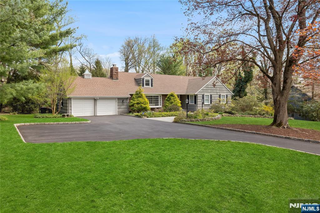 Sophistication & High-End Appointments meld w/Quality, attention to detail & elegance in this Stunning & Spacious renovated Ranch, located on a quiet residential street. Set on an exquisite acre of incredible property w/expansive rear yard, this remarkable home is your ultimate sanctuary of exceptional one level living. The rooms are oversized, warm & inviting, w/beautifully finished hardwood floors. The LR w/wd-burning FPL opens to The DR & 4-season Sun Rm. An Open Concept Kitchen/quartzite Cntr Island has Cherry Cabinetry, Wolf Cooktop, Dble Ovens, opens to the Cathedral Ceiling Great Rm/Wd-burning FPL, wet bar, & views of the exceptional property. The Expansive Primary Suite w/Cath Ceiling has a rm sized WIC, & Marble Primary Bth/Sauna & Whrlpl. Two additional Bdrms, & Bth plus a Pdr Rm & Stunning Lndry Rm complete this level. The 2nd level offers an expansive Bonus Rm/windows, skylights, WIC, & a stunning Bth! The partially finished Basement is a bright space for recreation, music, study..Plus an immense unfinished area w/access to the 2 car garage. The Rear Yard is a vision of natural beauty..it offers exceptional space for outdoor recreation, & privacy..Partially fenced. Additional upgrades include New Boiler, New HWH, Newly Paved Driveway, New Stonework walkway ALL 2025. Dual Trane A/C system Professional Grade 2018, 15 zone sprinkler system, LED Lighting, 8 zone Smart Thermostats, PLUS MORE. IF you are seeking quality, beauty, & spectacular living, this is your home!