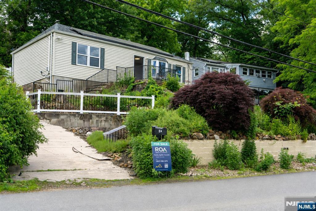 Welcome to 20 Greenwood Ave, nestled in the charming Haskell section of Wanaque, NJ. A warm, close-knit town known for its scenic beauty, small-town feel, and strong sense of community. Enjoy the perfect balance of peaceful suburban living with everyday convenience, just minutes from Routes 287, 23, and 208, offering an easy commute throughout North Jersey and into NYC. Nearby NJ Transit options and major roadways make travel simple while still allowing you to come home to the quiet comfort Wanaque is known for. Surrounded by parks, reservoirs, local shops, and dining, this location offers the lifestyle buyers are looking for: convenience, charm, and a true sense of home in one of Passaic Countyâ€™s most welcoming communities.