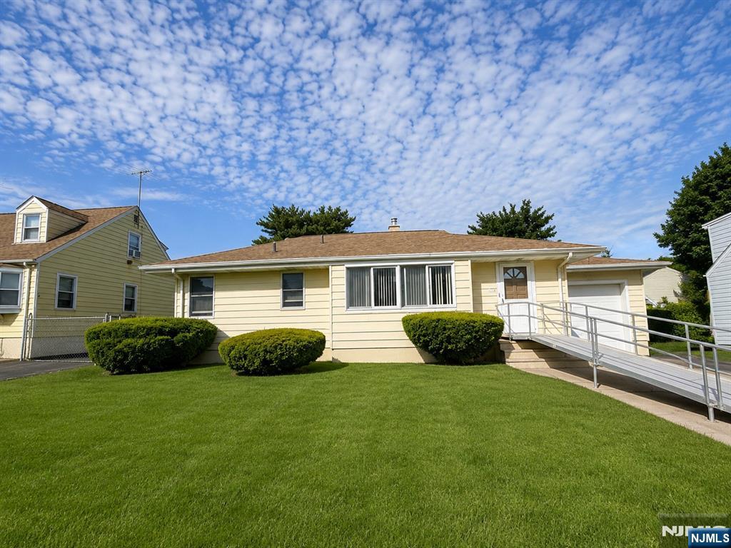 Welcome to this well-maintained ranch-style home located in the highly sought-after Hillcrest section of Paterson, bordering Totowa. Situated on a generous 75â€™ x 100â€™ lot, this charming property offers comfort, convenience, and plenty of potential. Featuring 2 spacious bedrooms, 2 full bathrooms, eat in kitchen, living and dining room. This home boasts beautiful, newly refinished hardwood floors throughout the main living areas. The semi-finished basement consisting of multiple rooms provides additional flexible space perfect for a family room, home office, gym, or recreation area. Also includes a utility and laundry area. Enjoy outdoor living in the private backyard complete with sliding glass doors to deck, ideal for entertaining, relaxing, or enjoying summer gatherings. Additional highlights include: recessed radiators, built in wall a/c unit, attic fan, ample outdoor space plus lots of off street parking for up to 5 vehicles; one car attached garage and 4 cars in the driveway! Conveniently located near schools, public transportation, shopping centers, restaurants, and major highways, this property offers the perfect combination of suburban comfort and commuter convenience.