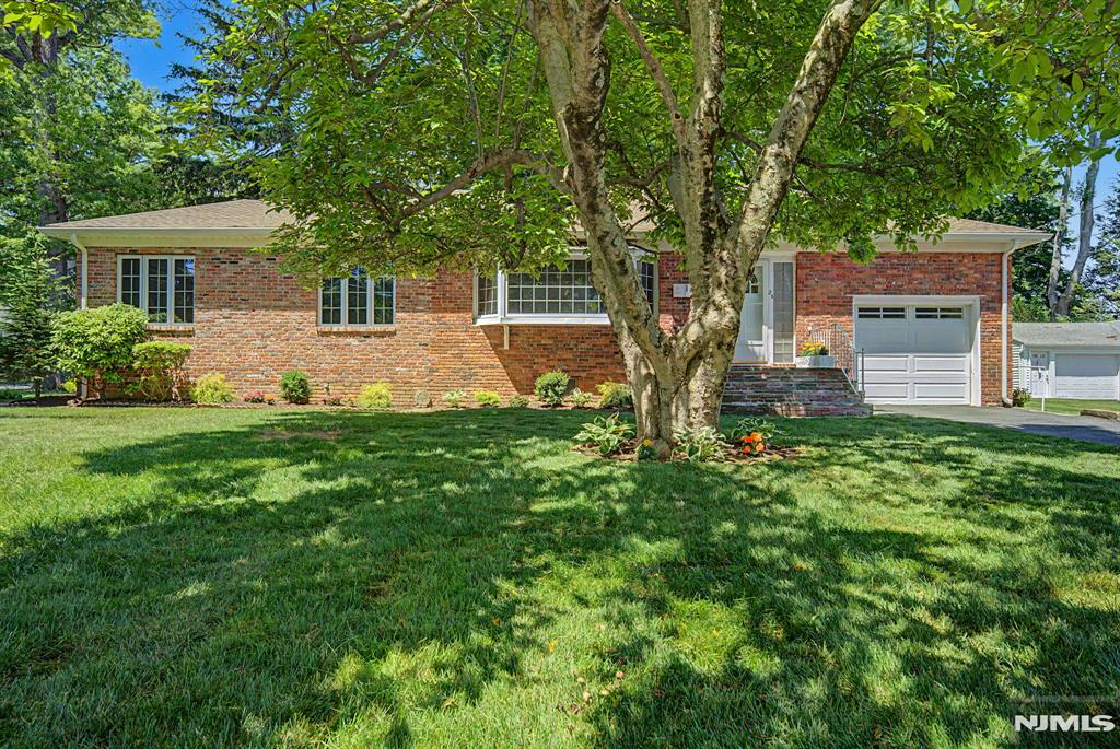 Welcome to this beautifully maintained brick ranch situated on a desirable corner lot in one of Denville's most convenient locations. Just a short drive from vibrant downtown Denville, shopping, dining, Gardner Field, parks, access to major highways, and NJ Transit, this home offers comfort, character, and convenience. Step inside to discover a warm and inviting living room highlighted by a stunning custom flagstone wood-burning fireplace and gleaming hardwood floors. The open-concept living and dining areas flow seamlessly into the kitchen, creating an ideal layout for everyday living and entertaining. This home features three bedrooms and a full basement offering versatile living space, including a workshop area, a cold wine cellar, and abundant storage. A bright family room surrounded with windows allows an abundance of natural light... with built-in bookcases overlooks the backyard and provides direct access to the deck, creating the perfect setting for indoor-outdoor enjoyment. Additional highlights include a walk-up attic with exciting expansion potential, fresh interior paint, updated landscaping, a new front roof, buffed & shined hardwood floors, and a backyard shed for additional storage. Lovingly cared for through the years, this special property presents a rare opportunity to own a home with timeless charm, flexible living spaces, and an exceptional location in Denville. ADT Security system.