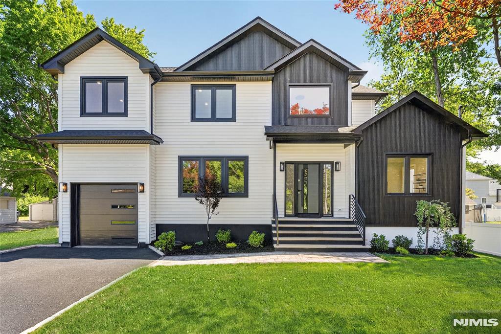 One-of-a-kind new construction built on an existing foundation, thoughtfully designed with today's lifestyle in mind. This stunning 5-bedroom, 3.5-bath home features 9-foot ceilings on the first floor, creating an open and airy atmosphere throughout. Sun-drenched living spaces are enhanced by oversized luxury windows and beautiful hardwood flooring on both levels. The gourmet kitchen flows seamlessly into the main living and dining areas, making it ideal for both everyday living and entertaining. Luxurious finishes can be found throughout, including heated bathroom floors for added comfort and convenience. Retreat to the expansive primary suite, offering a private sanctuary with a spa-inspired bath and generous closet space. A fully finished basement provides valuable additional living space, perfect for a recreation room, home office, gym, media room, or guest accommodations. With spacious bedrooms, modern design, and exceptional craftsmanship throughout, this home delivers the perfect blend of elegance, comfort, and functionality. A rare opportunity to own a truly exceptional new construction home.
