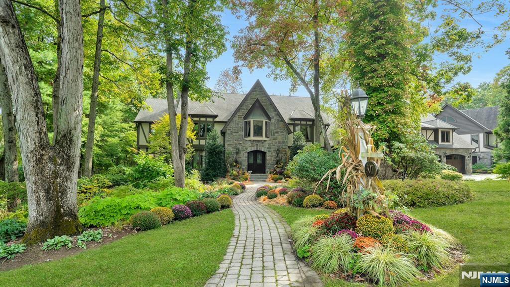 Breathtaking in every way, this extraordinary Manor Colonial is set on 2 private, tree-lined acres. With 8,000+ SF of refined living space, this home delivers architectural distinction & seamless indoor/outdoor luxury. A dramatic foyer introduces expansive formal living & dining Rms, a private Library/Home Office & a sophisticated Family Rm w/ vaulted loft & casual dining. A sun-drenched Sunroom captures tranquil views of the manicured grounds. Hand-painted murals & custom wood cabinetry elevate the interiors. The 2008 expansion transformed the home into an entertainerâ€™s dream, adding a spectacular Great Room with custom bar & a window wall opening to an elegant stone patio w/ outdoor fireplace. Home also includes a Gym, Game Room with bar, sitting rooms, and a private au pair suite, all thoughtfully positioned for comfort & privacy with dual staircases. The Chefâ€™s Kitchen is exceptional, featuring 2 islands, fireside sitting area and professional grade Wolf & SubZero appliances. Outdoor living is a private resort: heated gunite pool, spa, natural waterfalls, Koi pond, rustic pergola & multiple stone patios. The epoxy-finished garage includes 2 EV chargers. Modern amenities include Central Vac, sprinkler, Savant audio/video system & a gigabit hardwired network throughout. A rare offering where craftsmanship, technology, and resort-style amenities converge, this is luxury living on an extraordinary level & a property that must be experienced to be fully appreciated.