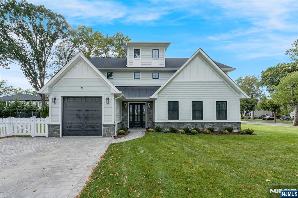 Stunning new construction home built on an existing foundation, nestled in the highly sought-after community of Glen Rock, New Jersey. This exquisite residence offers approximately 3,600 square feet of thoughtfully designed living space, not including the expansive basement, providing ample room for comfort and functionality. Upon entering, you are greeted by an open layout that seamlessly connects the living, dining, and kitchen areas, creating an inviting atmosphere perfect for both everyday living and entertaining. The home office is a valuable addition, catering to the needs of today's remote work lifestyle. The property boasts five generously sized bedrooms and four well-appointed bathrooms, ensuring space and privacy for all family members. The highlight of the home is the huge primary suite, featuring a luxurious walk-in closet that offers abundant storage and organization options Outdoor living is equally impressive, with a covered patio space that serves as an ideal setting for outdoor entertaining or simply enjoying a quiet evening. The home's location is unparalleled, offering close proximity to top-rated schools, beautiful parks, and convenient transportation options, making it an ideal choice for families and commuters alike. 209 Cornwall Road is a perfect blend of modern design and practical living, set in a prime location that provides both tranquility and accessibility. Schedule your private showing today!