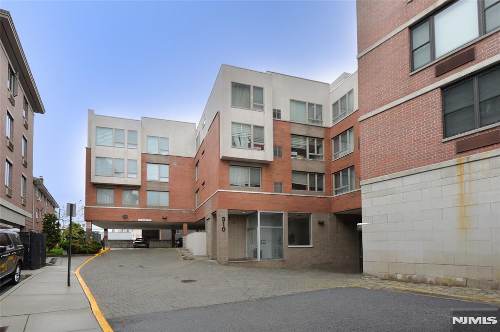Modern and move in ready condo in a newer 2008 development featuring oversized windows and an abundance of natural light throughout. this unit includes 2 deeded garage parking spaces and the convenience of an in unit washer and dryer. Ideally located just a short walk from Palisade Ave and Anderson Ave, and a short drive from River Rd, offering easy access to NYC transportation, shopping, restaurants, and more. The unit offers 2 generously sized bedrooms, including a primary suite with a private full bathroom. The open concept living area flows into the kitchen, complete with a center island perfect for entertaining. recent updates include a newer dishwasher, oven, washer dryer, and hot water heater. With low maintenance fees, unbeatable proximity to NYC, two garage parking spaces, and true move in ready condition, this is an exceptional opportunity you don't want to miss.