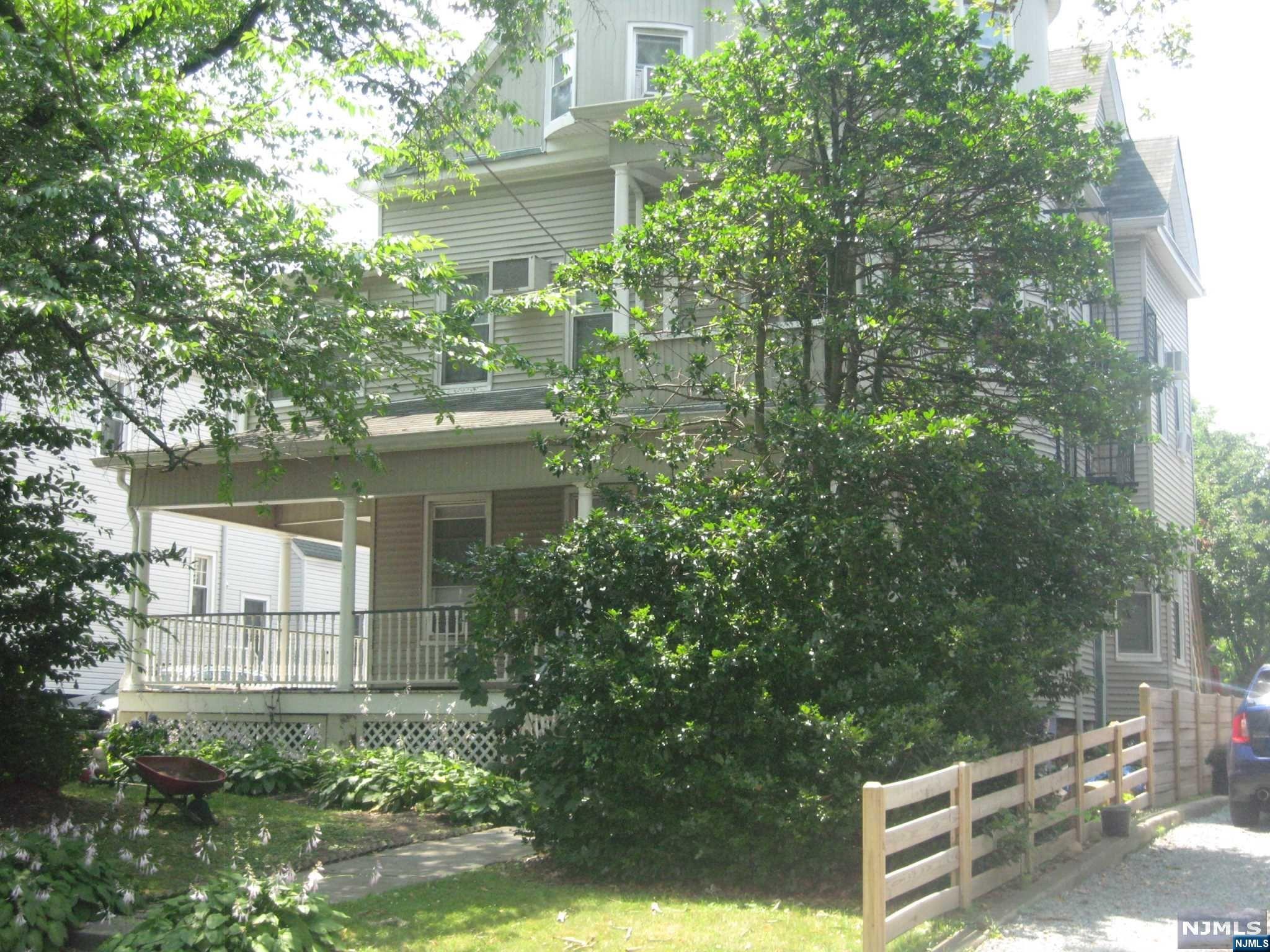 Welcome to this charming property that presents an excellent opportunity for anyone seeking a home with lots of potential. 4145 sq ft of living area. Unit 1 - 1st fl has Kitchen, Dining room, Modern eat-in kitchen, living room, and laundry. The second floor - five bedrooms, full bath unit. Unit 2 is on the third floor with it's own entry - Kitchen, living room, two bedrooms, and Full bath. This home was originally a single family home. Deep level property, convenient location.