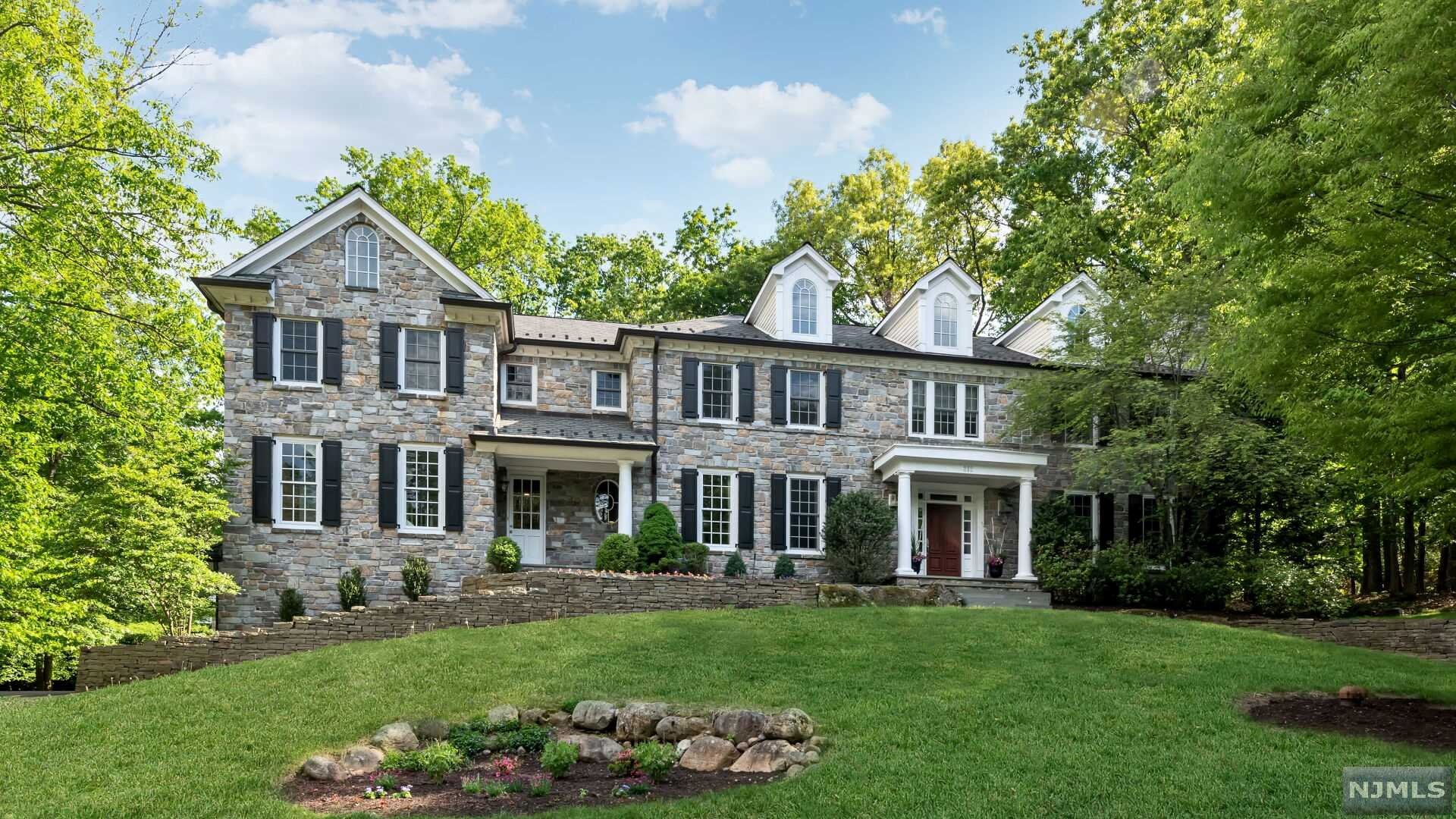 Classic Architecture meets Modern Day Style and Design in this extraordinary home located in one of Franklin Lakes most desirable neighborhoods. Only steps away from the town's famous Indian Trail Club and Market Basket Shopping Center, residence here enjoy the best of the best in terms of town amenities and lifestyle. Find over 7300 sf of chic luxury. Relax and socialize in any of the main rms including a tranquil LR, expansive kit/open fam rm, and banquet sized DR. Work from home in the custom library w/fpl and fr doors to an awesome covered porch overlooking the back yard. All 5 Br's on the 2nd fl are peaceful and inviting. Primary br w/fpl, 2 WIC, plus LUXE Bth w/radiant. 2 add'l ensuites and 2 more br's share a jack and jill bth, 2nd fl lndry. LL w/ample play space, theatre, arts and crafts, kitchenette, full bth. PERFECT mudrm w/bath! Hardwood floors throughout, whole house generator, radiant heat in kit, mud rm, prim bth. Cul-de-sac location w/rm for a pool!