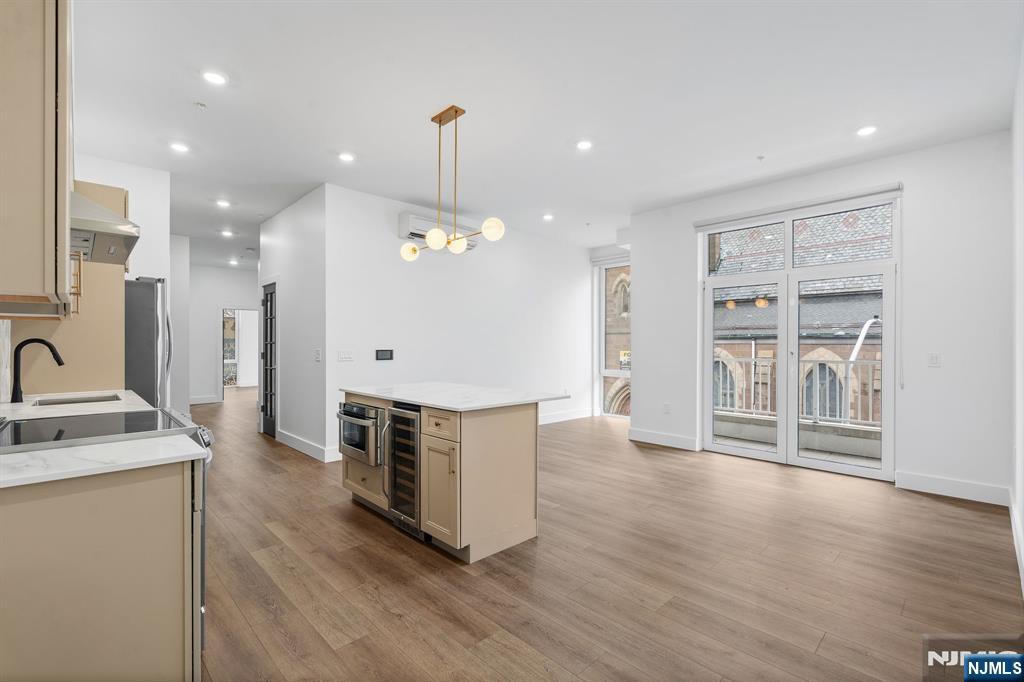 Discover this stunning 3-bedroom, 2-bathroom condo nestled in one of Newark's newest boutique condominium developments, perfectly positioned along the iconic Lincoln Park. This move-in ready residence blends contemporary finishes with everyday comfort in one of New Jersey's most connected urban neighborhoods. Step inside to find a spacious, light-filled layout designed for modern living. The unit features central air conditioning and in-unit laundry for effortless convenience, while sleek finishes throughout make this home as stylish as it is functional. With three generously sized bedrooms and two full bathrooms, there's plenty of room to live, work, and entertain. The real showstopper? Direct park-facing views of Lincoln Park right from your own home a rare and coveted feature that brings a sense of calm and greenery into everyday city living. Commuters will love the unbeatable location just minutes from Newark Penn Station with direct PATH train access to Manhattan, and only a short drive to Newark Liberty International Airport. Whether you're heading into the city for work or catching a flight, you're always right where you need to be. With Lincoln Park at your doorstep and dining, shopping, and entertainment all within easy reach, this is truly a home that has it all. Don't miss this rare opportunity to own a park-facing residence in one of Newark's most exciting new developments.