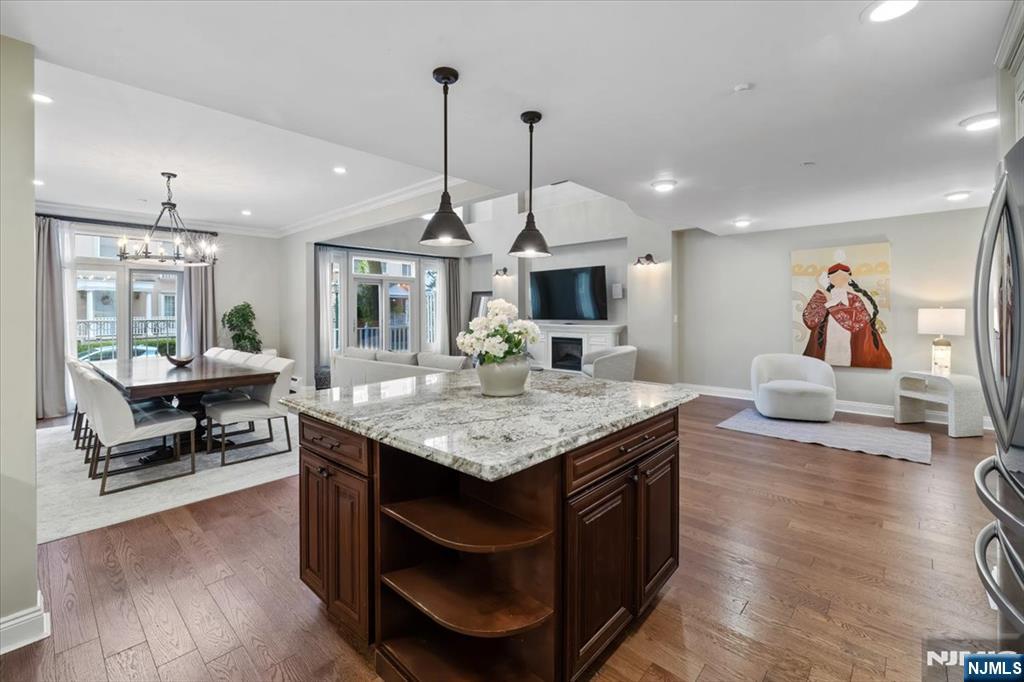 {OPEN HOUSE on July 25th at 12-2PM}. Luxury Waterfront Duplex in Port Liberte, Short Sale Opportunity. Welcome to this renovated 3-bedroom, 2.5-bath duplex offering 2,180 SF in the gated Port Liberte community. Features include soaring ceilings, floor-to-ceiling windows, a private bi-level patio, fireplace, hardwood floors, in-unit washer/dryer, 2-zone central A/C, and 1 assigned garage parking space, plus guest street parking. The open layout includes a spacious living and dining area and a chef's kitchen with quartz countertops, soft-close cabinetry, premium appliances, double dishwasher, water filtration system, and a large island. Upstairs features a loft, ideal for a home office or media room. The primary suite offers a walk-in closet and spa bath with a whirlpool tub and separate shower. Two additional bedrooms share a full bath. Enjoy resort-style amenities including two pools, fitness center, tennis & basketball courts, clubhouse, dog park, playground, optional boat slips, 24/7 gated security, on-site NY Waterway Ferry, and shuttle to Grove Street PATH. Felina Steak, Hudson House, and The Stork Club are nearby. HOA includes: water, hot water, garage parking, flood insurance, landscaping, snow removal, trash collection, security, and full access to all amenities. Short sale subject to lender approval. Property has an approximate $170,000 special assessment. Seller intends to satisfy the assessment from the sale proceeds at closing, subject to lender approval.