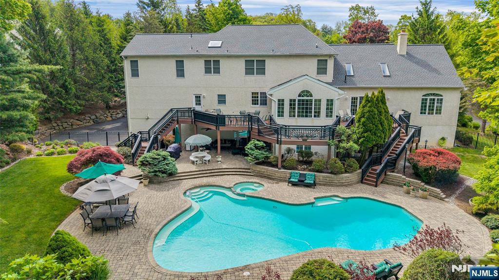 PRISTINE, MOVE-IN READY 4 BEDROOM, 3.5 BATH COLONIAL WITH BEAUTIFUL INGROUND POOL ON 1+ ACRE OF PROFESSIONALLY LANDSCAPED PROPERTY! This original Mercer Provincial Grand model with added sunroom off of kitchen, conservatory room off of family room, and bonus media/game room over garage is truly ONE OF A KIND! The first floor features a two-story foyer, large eat-in kitchen, sunroom, family room, conservatory, office, formal dining room, living room, game room, media room, laundry room, powder room, and pantry. The second floor consists of a spacious primary bedroom, large primary bathroom, additional generously sized bedrooms, hall bath and exercise room. The finished basement offers 10-foot ceilings, LED lighting, plenty of storage, and sliders leading to the pool and paver patio. There is also a convenient, roomy pool bathroom in the basement, complete with shower, custom lockers and separate door to the patio and pool area. This property features a newer lifetime roof, sizeable attached 3 car garage, clear cedar decks, security system, whole-house music system (inside and out) and internet hookups in all rooms. Don't miss the opportunity to enjoy this beautiful home with inground Gunite chlorine pool with attached whirlpool/spa, large capacity pool heater, custom paver patio, outdoor lighting, and fenced in back yard.