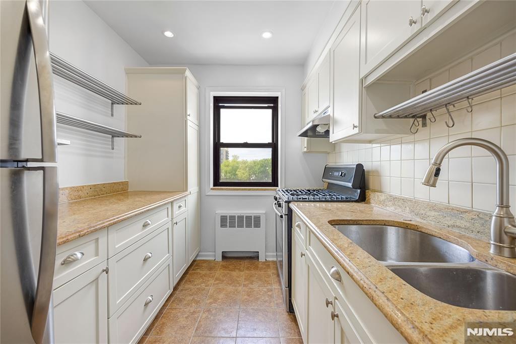*Realtor is owner of unit. Newly renovated 2-bedroom, 1-bathroom apartment in the heart of Fort Lee. Unbeatable location with NYC transportation just steps away (approximately a 20-second walk from the building), and within walking distance to the vibrant downtown area featuring IPIC Theaters, LaNoma high end restaurant, Otter Sushi, CVS Pharmacy, scenic hiking trails, coffee shops, and many other popular destinations. The kitchen offers ample cabinet and shelving space and comes equipped with a stovetop, oven, and refrigerator. Both bedrooms are generously sized and can comfortably accommodate large furniture. The apartment also features a spacious living room, a newly updated bathroom, and the convenience of in-unit laundry. Pets are permitted with verified ESA or service animal documentation.