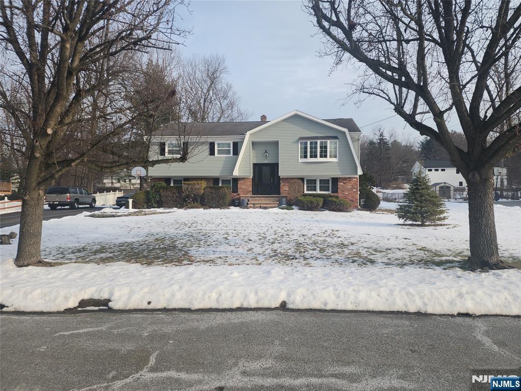 Welcome to this well maintained Bi-level, perfectly situated on a quiet cul-de-sac in a desirable neighborhood. Enter through the NEW front door & head up the stairs into the living room that is open to the formal dining room that leads to the eat in kitchen with newer SS appliances. As you head down the hallway, you'll find the main bathroom that offers a NEW stall shower as well as 3 bedrooms with the primary offering an additional 1/2 bath. This great home offers a versatile layout with a spacious lower level that has NEW flooring & includes a kitchenette, a 2nd half bath, laundry & direct access to the beautifully landscaped yard... a great space for entertaining & perfect for extended living. The property boasts excellent curb appeal with NEW siding, many NEW windows, wood floors under the carpeting, C/A & inside access to the 2 car garage (1 of the garage spaces was partially closed off to make for a storage room but could easily be taken down & returned to a garage space) & an oversized driveway that can accommodate many cars. While the home could use some additional updating, it provides a fantastic opportunity to make it your own. Conveniently located just minutes to shopping, restaurants, & all major highways, this home combines comfort, an unbeatable location & presents an excellent opportunity to customize it to your exact specifications that reflect your own personal style! Don't miss out on this exciting opportunity to make this house your very own DREAM HOME!