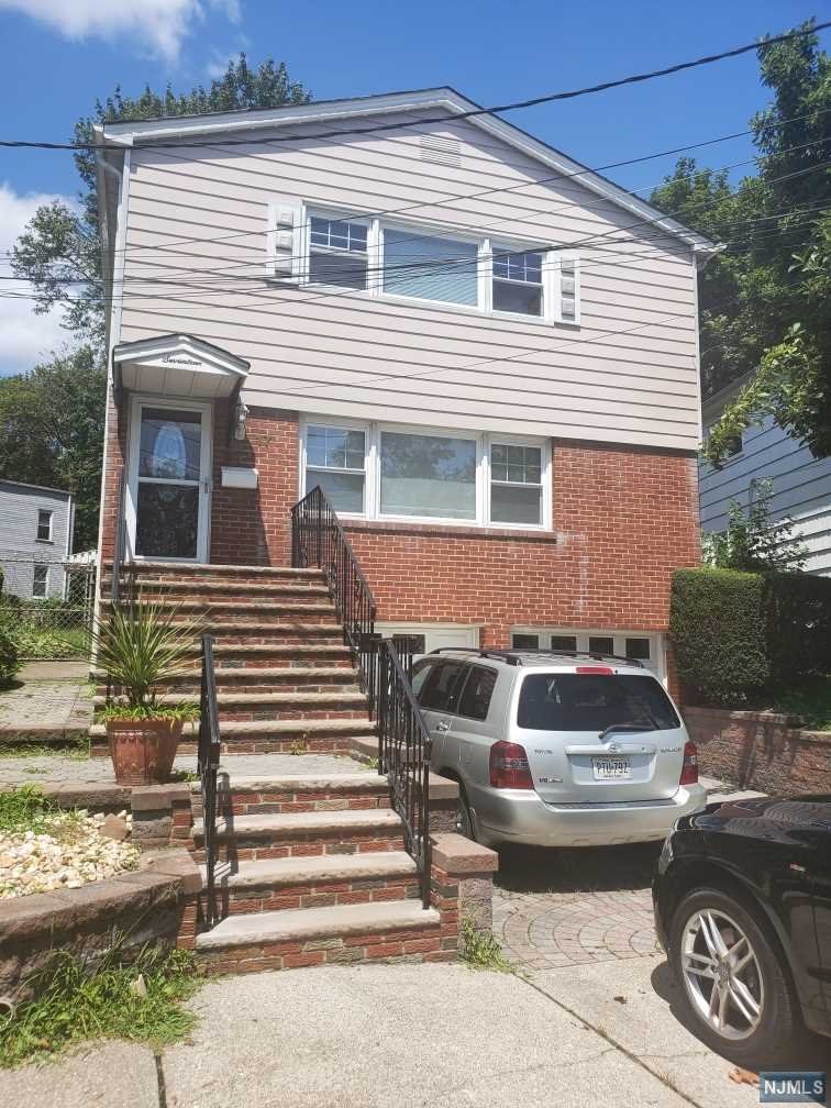 Maintained 2 family home on cul-de-sac. Close to trsnsportation park, schools, shopping, Houses of Worship, highways. Both floors have similar floor plans. First floor has been updated. Living room, dining room, eat-in-kitchen (gas range, ref., d/w), full bath, BR, BR, MBR with Mbath(stall shower). Refinished hardwood floors. Second floor, LR no, DR, EIK,full bath,BR, BR, MBR with MBath(stall shower). Hardwood throughout. Access to basement from rear stairwell and side exterior entrance for both apartments. Separate laundry hookups. Separate utilities (except cold water). Gas, hot water baseboard heat. Large two car garage built-in underneath. Sold As-Is