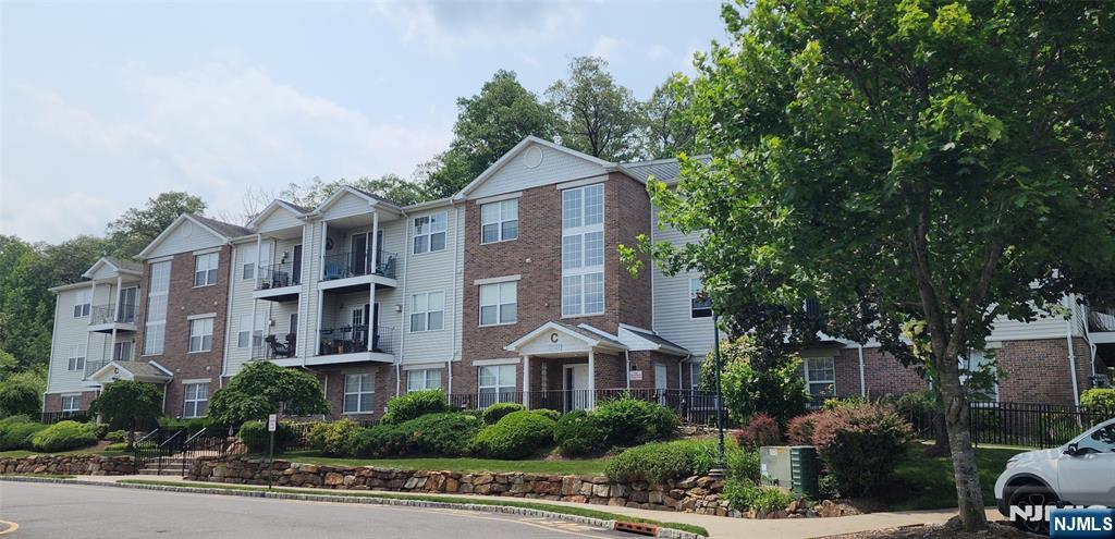 Welcome HOME to this freshly painted, very clean and move in ready condo! Located on the 3rd floor of an elevator building, this bright, beautiful unit provides comfort as well as convenience. Offering 1 Large BR with a bonus room that is perfect for a nursery, a home office, or possibly a walk-in closet... whatever suits your lifestyle best, There is laundry (washer/dryer included), a full bath, Kitchen with a breakfast bar, plenty of cabinet and counter space, BRAND NEW SS dishwasher & garbage disposal, a good size pantry plus a utility closet and is open to the large LR/DR with a gas fireplace & French doors leading to your own balcony, ideal for morning coffee or relaxing evenings, providing some gorgeous mountain views. There's laminate flooring in the LR/DR, carpet in the bedroom and bonus area, crown molding throughout, C/A, plenty of closet space with closet organizers in the bedroom, LOW TAXES & water is included in the maintenance fees. Located close to the school, all major highways & shopping, Rock Creek Crossing is a wonderful community offering many amenities such as a club house with an exercise room, tennis, a playground for the little ones & with summer upon us, there's still time to enjoy the outdoor pool too. This is a beautiful condo in a wonderful community that you'll love calling HOME...Small dogs up to 25 lbs. are welcomed...1 pet per household