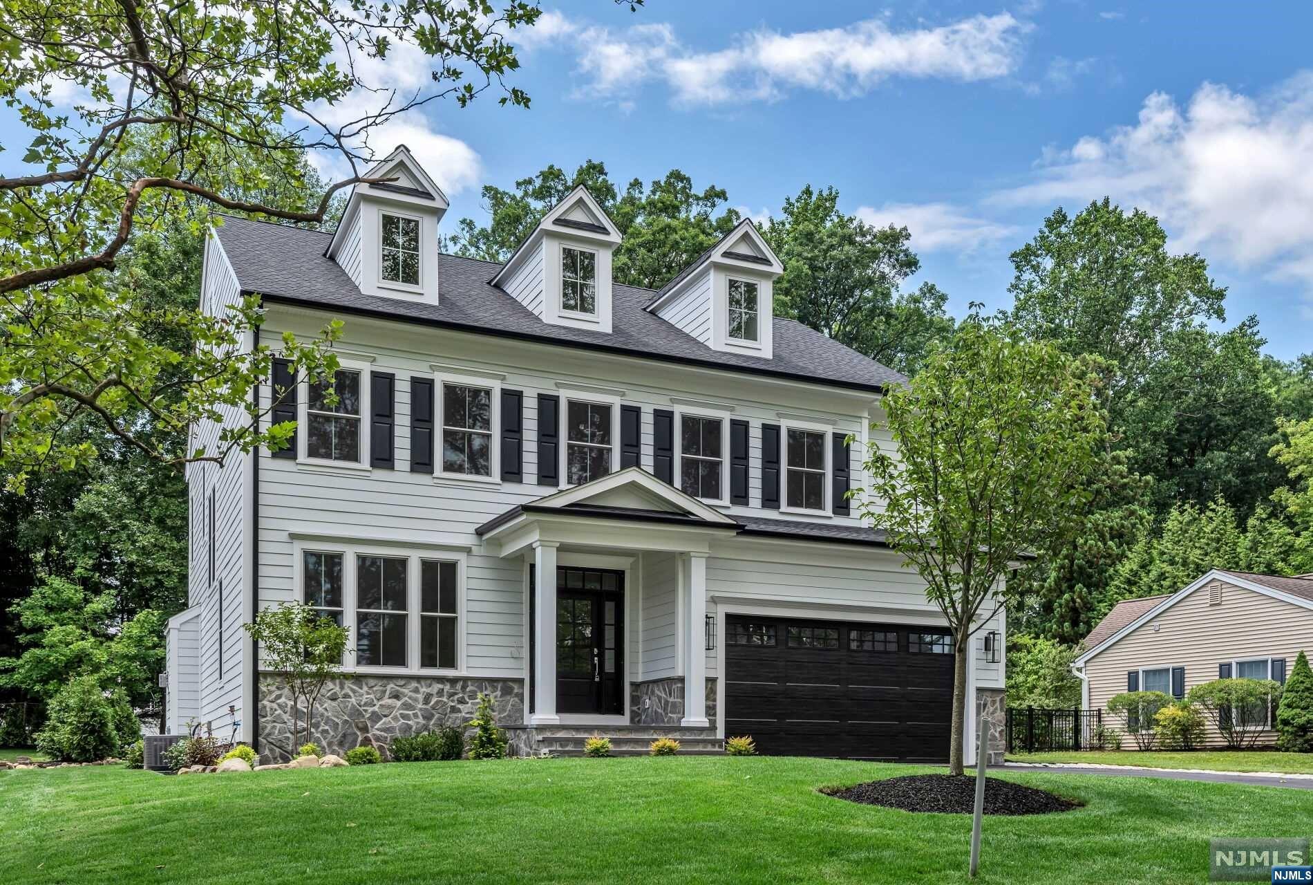 Completed to perfection! Welcome to 5 Townsend, a stunning, 5-bedroom, 5.5-bathroom home located in Florham Park, NJ. Situated in a sought-after section of town - proximate to Route 24, Morristown Airport, and charming downtown Madison - this residence offers four floors and over 5,000 sq. ft of finished space. Flooded with natural light, the first floor features an expansive great room with custom entertainment wall, gourmet kitchen equipped with state-of-the-art appliances and oversized island, and dining room with direct patio access. The innovative floor plan offers tremendous lifestyle flexibility with its den, flex room and pocket office. The second floor features an owner's suite with two walk-in closets and a luxurious en-suite bathroom, plus three additional spacious bedrooms, one of which is a junior suite with en-suite bathroom. The third floor features a fifth bedroom and full bathroom. Not to mention a fully finished basement! All this home is missing is you!