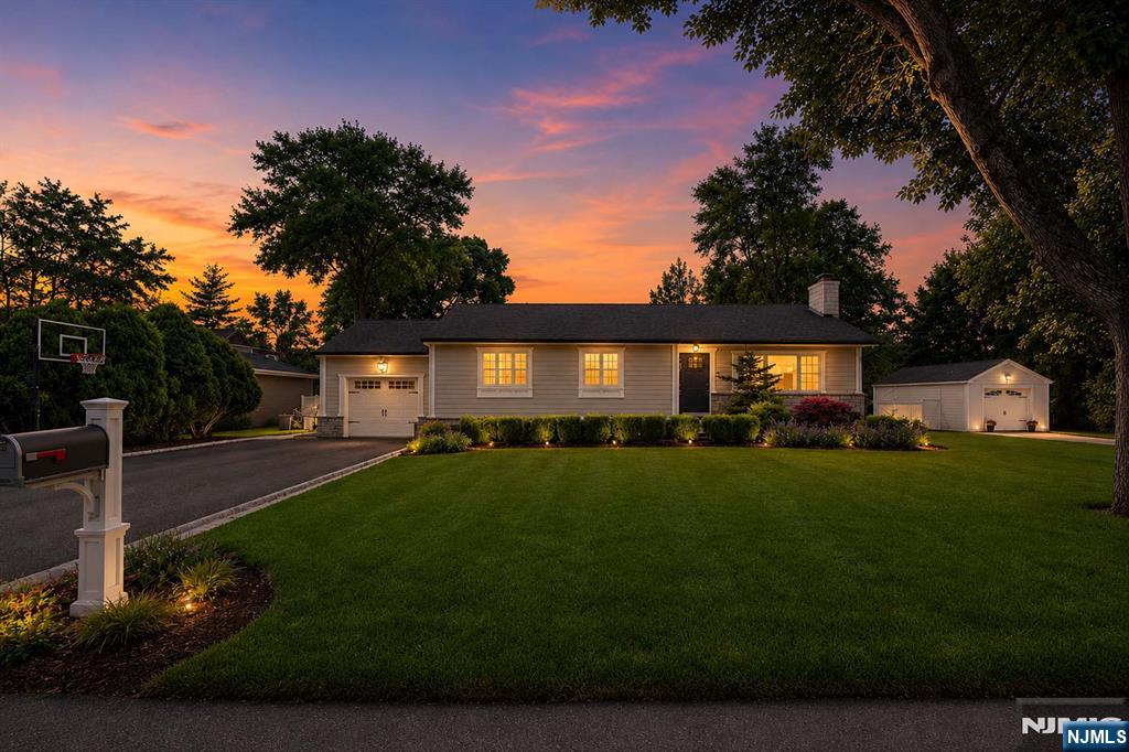 Welcome to this beautifully renovated ranch, offering the perfect blend of modern style and everyday comfort. Nestled on a quiet cul-de-sac, this inviting home features an open floor plan with a spacious living room highlighted by a quartz surround fireplace that flows seamlessly into an expansive chef's kitchen featuring a large center island, stunning Statuario Venato quartz countertops, high-end appliances, and an adjoining dining area, creating an exceptional space for both entertaining and everyday living. Two generously sized bedrooms and a full bathroom complete the main level, including a spacious primary bedroom with a large walk-in closet. The finished lower level expands the living space with endless possibilities for a recreation room, home office, gym, or guest suite and includes a second full bathroom. Thoughtful updates throughout provide true move-in-ready convenience. Step outside to a private backyard, perfect for relaxing or hosting entertainment, while an attached garage adds everyday practicality. Ideally located close to parks, shopping, dining, top-rated schools, and NYC mass transportation, this turnkey home presents a rare opportunity to enjoy comfortable living in one of Bergen County's most sought-after communities. Comprehensive video tour, floor plans, interactive 3d model & more information available at https://newjerseyproper.com/mls-14-morrow-rd-midland-park-nj/