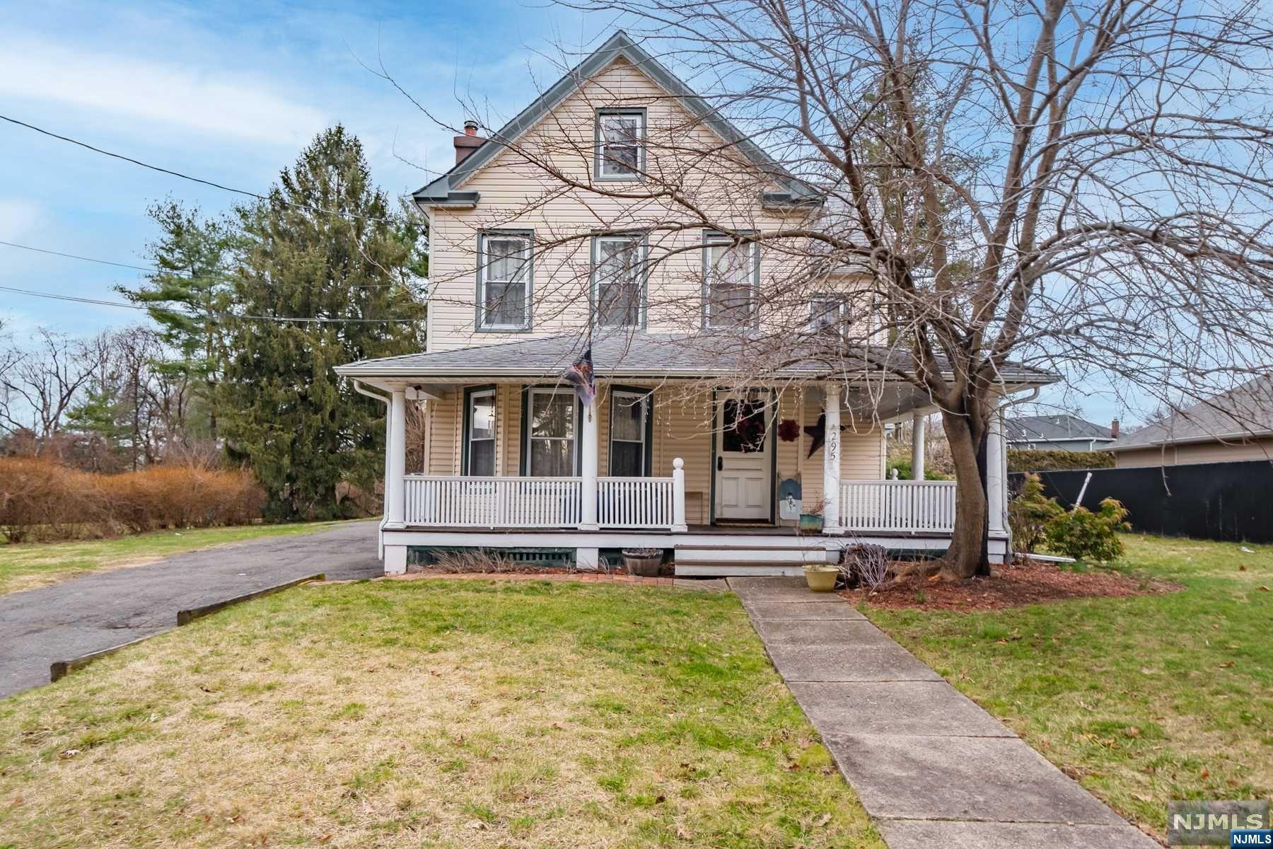 Lovely 1,850+ sq ft colonial on an oversized piece of property in Wayne! Charming wrap-around lemonade porch. The home offers 4 bedrooms and 1.5 bathrooms. First Floor features large LR, DR, Kitchen, and 1/2 bathroom. Kitchen offers plenty of cabinet space. Cozy wood burning Fireplace in the living room. Upstairs, find 4 bedrooms and 1 full bathroom. 2 car garage and long driveway that can accommodate multiple vehicles. Bedrooms are all a great size. Wayne offers excellent school system and easy and quick access to all local highways. Do Not Miss!