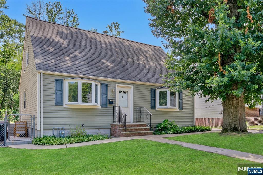 What a find! An oasis in Teaneck, NJ, this 4 bed, 2.5 bath Cape Cod style home has a backyard that makes you feel like you're in the country! This deep yard has a patio, beautiful garden, and beyond the main yard is a lower level garden which looks out upon a natural forest providing incredible privacy. This roomy cape has central air, newer furnace and hardwood floors. First floor features a living room with bay window, kitchen with dining area, 2 bedrooms and a full bath. Second floor has 2 beds and a full bath. Unfinished, large basement. Come take a look at this private home on a lovely street in Teaneck!