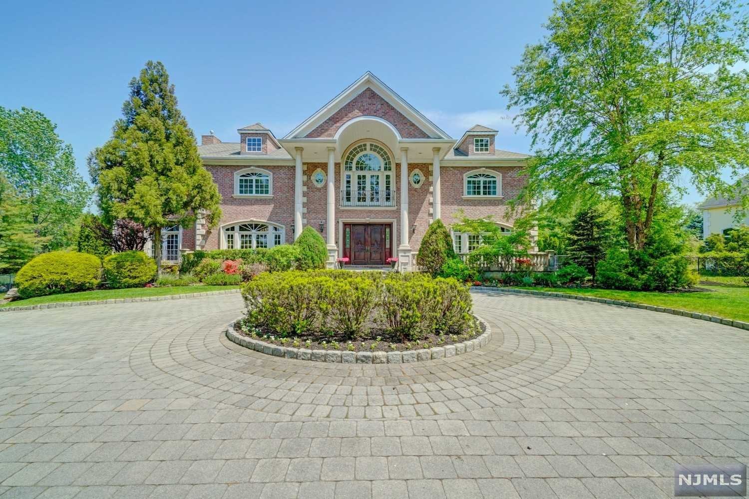 Magnificent sprawling estate in prestigious Alpine. Brick construction w/ front, rear & 2nd floor stone terraces. Heated in-ground pool w/ waterfall. Conveniently located 8 mi from NYC w/ Blue Ribbon schools & lots of anonymity. Enter thru the grand foyer w/ double wrought iron staircases to the 2nd fl interior balcony that overlooks the Great Rm w/ gas fireplace. The 1st Floor ft/ 11' ceilings, huge formal Dining Rm, Guest Rm, 2 Powder Rms, Music Rm, formal Living Rm & Library. Modern Kitchen ft/ large dining area, grand center island, Viking & Miele appliances & a Butler Station that leads to Dining Rm. Outdoor terrace connects the Kitchen, Great Rm & Library. Primary Suite w/fireplace + 4 ensuite Beds & walk-in Closets on 2nd Floor. Sauna, Wine Cellar, Movie Theater, Bed, Full Bath on Lower Level.