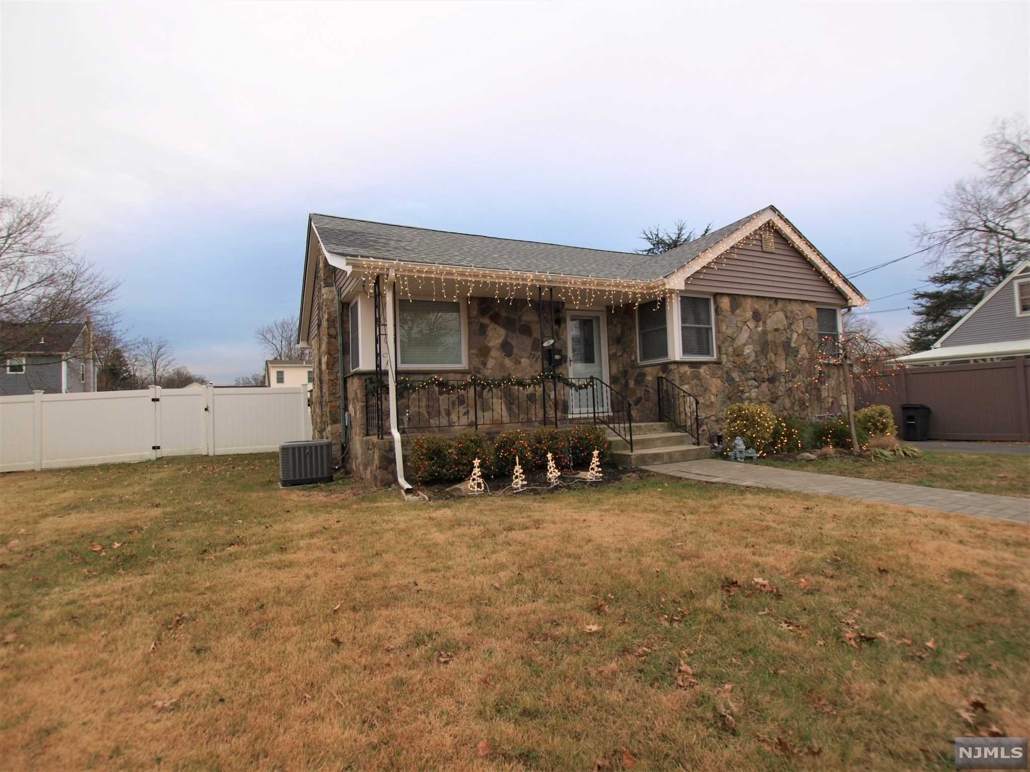 Recently Renovated Cape Cod (2017) located in the center of town. Beautiful lot with fenced in rear yard. Larger than it looks, approx. 1,332 sq. ft without the lower level. Updated from the Kitchen, Bathrooms, Siding, Driveway, heating, C/A, SEPTIC and more. Finished lower level offers a Family Room, Office Area and 2nd full bath, storage rooms and a walk up to outside rear yard. Nice size Living Room w/wood floors. Fireplace is non functional but great decor. Open floor plan to the Dining Room and Kitchen. Plenty of Cabinets, pantry, granite counters and all Stainless Steel Appliances included. 3 Season porch off the kitchen. 2 good size bedrooms and full bath on this level. 2nd floor offers a sitting area plus a good size bedroom. Septic new 2017, windows, electric, heating, the lists goes on and on. Non flood area and great location, close to almost everything in town. NYC at Corner, parks and schools minutes away. You won't be disappointed.