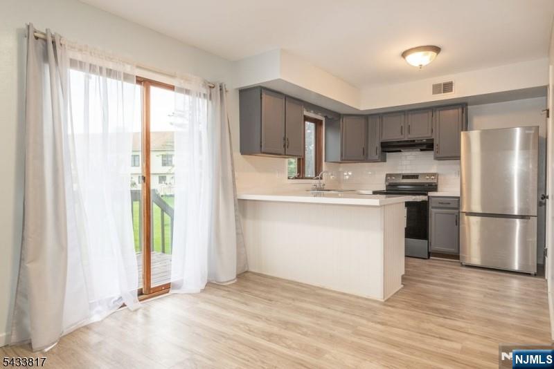 Fully renovated multi-level townhouse located in the highly sought-after Rolling Hills community. This bright and inviting home features new flooring throughout, a spacious living room filled with natural light, generously sized bedrooms, and a versatile 3rd floor loft area perfect for additional living or workspace. The primary bedroom includes a walk-in closet, offering ample storage and convenience. Sliding doors from the dining room lead to a private deck, ideal for relaxing or entertaining outdoors. A beautifully finished basement provides additional living space, while thoughtful updates throughout make this home truly move-in ready. Enjoy comfort, style, and functionality in one of the area's most desirable communities. HOA includes snow removal, water, trash, yard maintenance and sewer.