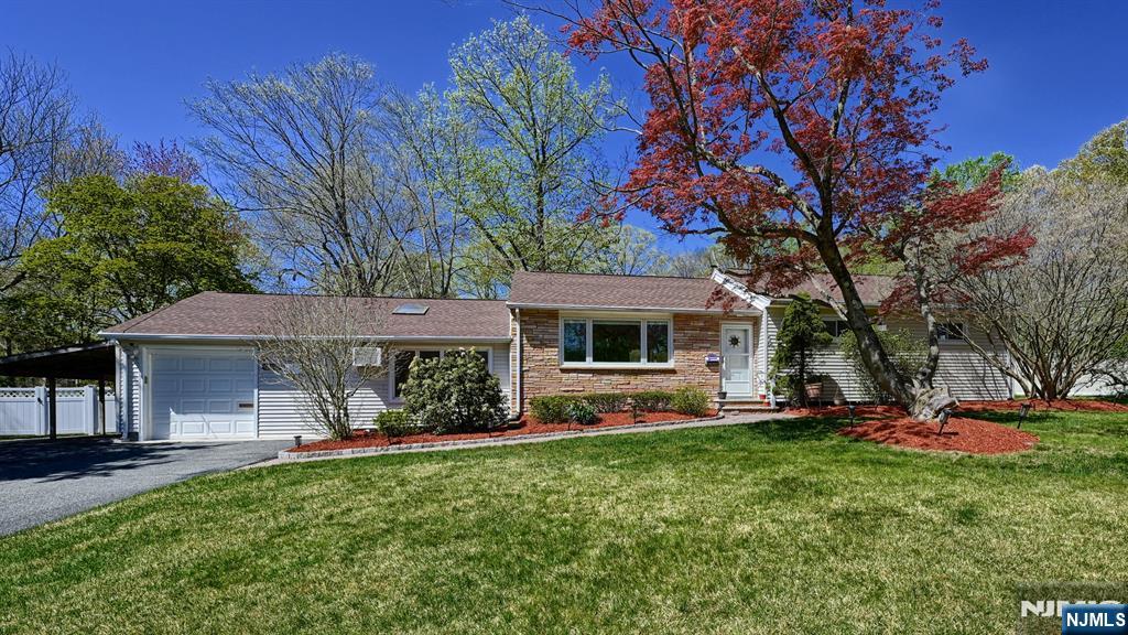 Set on a picturesque 1 + acre lot in sought-after Park Ridge, this sprawling ranch offers the perfect blend of privacy, comfort, and future potential. Tucked away on a quiet cul-de-sac, the park-like property backs to a serene creek, creating a peaceful natural backdrop that can be enjoyed year-round. Designed for effortless one-floor living, this well-maintained home also presents an exceptional opportunity for a second-level expansion. The current layout features 3 generously sized bedrooms and 2 full baths, including a spacious primary suite. A bright and inviting living room and formal dining room provide ideal spaces for entertaining, while the extended kitchen boasts abundant cabinetry and a charming greenhouse-style breakfast nook overlooking the lush yard. The sunken family room, complete with a cozy fireplace, flows seamlessly into an attached sunroom. Additional highlights include a large deck ideal for outdoor dining, a finished basement offering flexible living space, an attached garage, and close proximity to The Shoppes at DePiero Farms. This is a rare opportunity to enjoy tranquil living with room to grow in a truly beautiful setting.