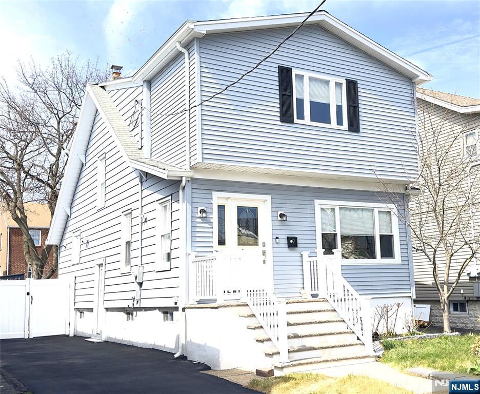 Welcome to this beautiful, move-in ready, recently RENOVATED colonial home, with 3 Bedrooms, 2 Full Baths. Newer recess lighting and hardwood floors throughout the whole home. The first floor boasts a large open floor plan for entertainment: large Living/Family room, beautiful kitchen, formal dining room, updated convenient full bathroom, 2 side doors to the backyard and to the driveway. Updated kitchen w/ quartz countertop, SS appliances, island with storage, seating and plenty of prep space and storage. Upstairs you will find 3 generously sized bedrooms and an updated large full bath. A fully finished basement waiting for your imagination with laundry and plenty of storage, easy access to the backyard through the bilco doors or the side door. Plenty of street parking but that isn't needed with the driveway that could fit 3+ cars. Fully fenced in backyard that is ready for all your BBQ's and summer nights. This home has everything and more! Nothing to do but move in and unpack! Great Opportunity to own in a wonderful neighborhood that is also Close to schools, walking distance to local shopping, NYC bus, bus to Harrison Path Train, & close to all major roadways (17, 21. 280, GSP, NJTPK)