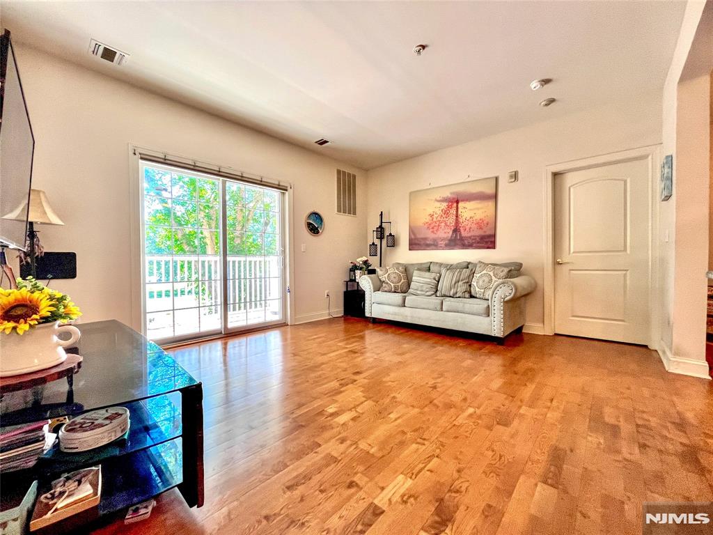Welcome to this beautiful 2BR, 2BA condo located on the 2nd floor of Building 2 in the desirable Windsor Park community. The unit faces the adjacent Overpeck Golf Course and offers a beautiful sunset view. It features a modern kitchen boasting stainless steel appliances, premium countertops, and ample cabinetry, opening seamlessly into a spacious living room with sliding glass doors to your private terrace. The primary suite offers generous closet space and a full bath with double sink vanity, bathtub and separate glass shower. Good sized 2nd bedroom with closet and 2nd bathroom with bathtub. Enjoy the convenience of full-sized in-unit laundry, secure elevator access, dedicated indoor parking space with plenty of guest parking and central air cooling/forced air heating. The pet-friendly complex features a premier modern style clubhouse with gym, meeting room, and entertaining space. Easy access to major highways, GWB and NYC public transportation. Convenient walking distance to restaurants, bakery, playground and sports complexes.