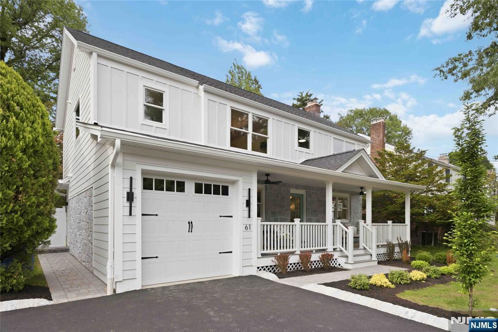 Conveniently located on a quiet street near downtown, schools, and bus stops, this transitional center-hall Colonial offers the best of modern living. Expanded and renovated to the studs, the home features new insulation, drywall, Hardie siding, roof, heating/AC, plumbing, and electrical systems. A beautiful front porch welcomes you into the home, where youâ€™ll find premium trim work, beautiful light fixtures, and modern white oak floors throughout. The first floor includes a living room with gas fireplace, dining room, open kitchen with a large Cambria stone islandâ€”a chefâ€™s dreamâ€”and a family room directly connected to the kitchen, creating ideal space and flow for entertaining. The mudroom connects both to the side yard and garage, serving as a convenient daily entrance. The second floor features a primary suite with a spacious spa-like bath and walk-in closet, an ensuite bedroom, and two additional bedrooms sharing a hall bath. The finished basement with tile floor offers excellent recreational space. A fenced backyard and patio provide a private outdoor oasis. Seller holds NJ real estate license.