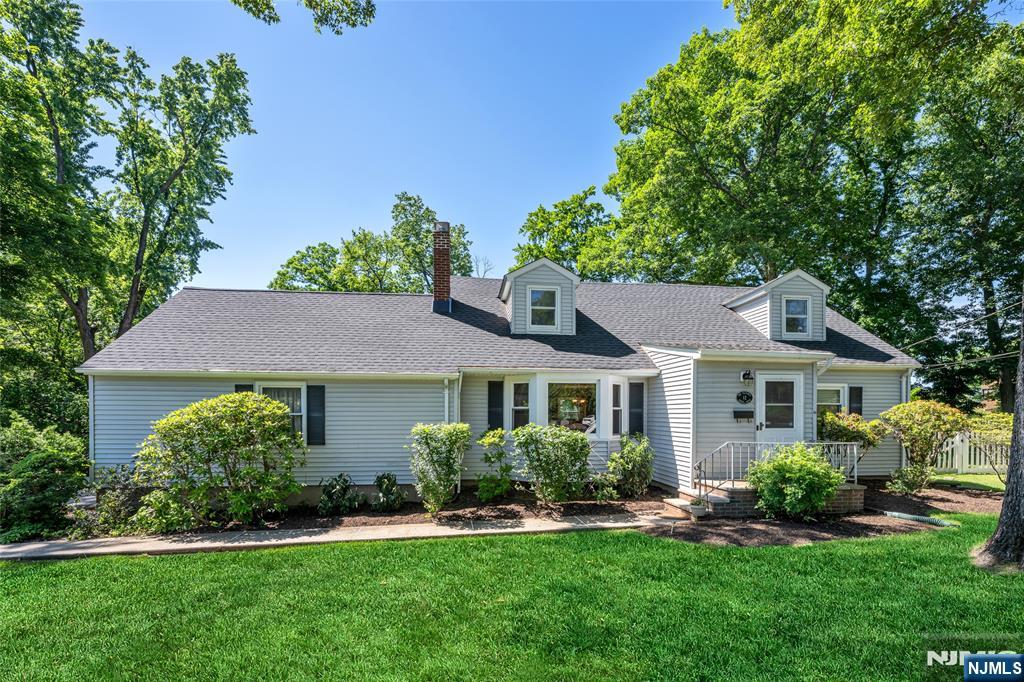 Welcome to this beautifully expanded 4-bedroom, 2.5-bath Cape Cod, ideally situated on a quiet cul-de-sac in one of Allendale's most desirable neighborhoods. Set on a stunning park-like property, this exceptional home offers the perfect combination of classic charm, generous living space, and modern conveniences. The inviting interior features gleaming hardwood floors, a spacious living room with a wood-burning fireplace, and a formal dining room perfect for entertaining. The expansive family room serves as the heart of the home, showcasing a wood-burning stove and seamless access to a bright and airy sunroom overlooking the beautiful backyard. These versatile living spaces provide the ideal setting for both everyday living and memorable gatherings. Offering four generously sized bedrooms and 2.5 baths, the home provides flexibility and comfort for a variety of lifestyles. A full finished basement adds valuable living space, ideal for a recreation room, media room, home gym, office, or playroom. Additional highlights include central air conditioning, baseboard heat, an attached two-car garage, and beautifully landscaped grounds that create a private, serene setting. The quiet cul-de-sac location offers added privacy and minimal traffic while remaining conveniently close to Allendale's top-rated schools, parks, charming downtown, shopping, dining, and NJ Transit service to New York City. .