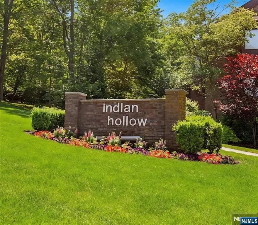 Welcome to this bright and inviting 2nd floor, 2 bedroom, 2 bath corner unit tucked away in the wonderful and sought after community of Indian Hollow. The open and spacious floor plan is bathed in natural light, creating a warm and inviting atmosphere throughout. The home features two nicely sized bedrooms, including a Primary Suite with its own private balcony, The Primary Bedroom also offers a walk-in closet and a full bathroom. Residents of this community enjoy wonderful amenities such as a sparkling in-ground saltwater pool with a patio featuring eating areas and BBQ plus scenic walking paths. Also included is a large one-car garage (deeded separately) and a private storage unit for additional space. Conveniently located near shopping, major highways, and NYC bus and train transportation, this home offers both comfort and convenience. Buyer Must live in this unit for the first 2 years. The condo is being sold "AS IS" and it offers great potential for customization to make it your own.