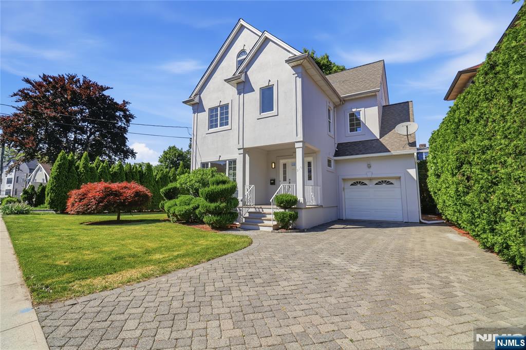 This beautifully maintained three-story Colonial combines classic charm with exceptional space and value, offering far more square footage than many newer homes. Designed for everyday comfort and effortless entertaining, the main level features a bright, spacious living room that flows into a formal dining room and an expansive eat-in kitchen with stainless steel appliances, generous cabinetry, and room for a breakfast area. A convenient powder room and extra pantry storage add to the functionality of this floor. Thoughtfully landscaped grounds create an inviting outdoor setting for gatherings, play, or relaxation. The second floor offers three well-proportioned bedrooms with ample closet space. The primary suite includes a private bath with a soaking tub, providing a relaxing retreat. The third level adds impressive flexibility, with two additional bedrooms, a full bath, and a versatile bonus area ideal for a playroom, home office, hobby space, or lounge. A fully finished basement expands the living space even further, featuring a laundry area and an open layout that can accommodate a home gym, media room, or recreation area. Located close to schools, shopping, dining, and everyday conveniences, this home also offers easy access to NYC bus transportation, providing a straightforward commute to Manhattan while enjoying the comfort of a suburban neighborhood.