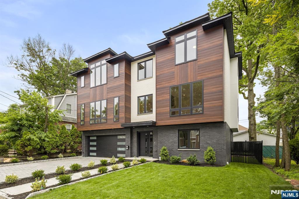 Expansive single-family home in Fort Leeâ€™s most convenient neighborhood. Over 4,000 sq ft set on a private dead-end street. The main level features an open living room and kitchen, built in electric fireplace to be installed, separate formal dining room, home office/den and private terrace, and a powder room. Island Kitchen boasts top of the line GE Monogram appliances, high powered range hood. Large Primary Bedroom with Walk in closets, eastern exposure, and high ceilings. Primary Bath with Soaking Tub and stand up shower (Additional primary bath photos coming soon!) Ground Floor has the 4th bedroom, Rec Room, full bath and access to the private patio. Unbeatable location Minutes to the GW Bridge and an easy walk to top-rated Public School #1, Main Street shops, Firemenâ€™s Park, Abbott Blvd, and NYC transportation. All the space you need in a quiet suburban setting without giving up city-life convenience! Come take a look!