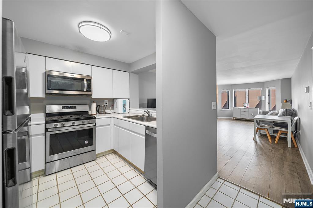 ***CALL/TEXT WAYNE BONSELL @ 607-239-0541*** Welcome to 503 Hancock Court, a beautifully maintained 1-bedroom, 1-bath residence nestled within Edgewater's sought-after Independence Harbor community. This bright and inviting home offers an ideal blend of comfort, convenience, and resort-style living along the Hudson River waterfront. The thoughtfully designed layout features a spacious living and dining area, a generously sized bedroom, ample closet space, and large windows that fill the home with natural light. The kitchen offers plenty of cabinetry and workspace, while the private outdoor area provides the perfect spot to enjoy your morning coffee or unwind after a long day. Residents of Independence Harbor enjoy an impressive collection of amenities including outdoor pools, tennis courts, a fitness center, beautifully landscaped grounds, and waterfront promenades. Commuters will appreciate easy access to NYC via ferry, bus, and major highways, while nearby shopping, dining, parks, and entertainment make everyday living effortless. Whether you're a first-time buyer, downsizer, or investor, this exceptional home presents a rare opportunity to own in one of Edgewater's most desirable waterfront communities.