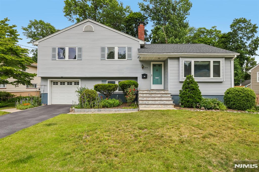 Welcome to this sunny and chic home nestled on one of Ridgewoodâ€™s rare cul-de-sacs, where youâ€™ll enjoy the best of both worldsâ€”a quiet, close-knit neighborhood setting just moments from the vibrant downtown. Thoughtfully designed with central ac, open-concept living and gleaming hardwood floors, this home offers versatile spaces for both everyday living and effortless entertaining. The spacious living room, anchored by a fireplace and oversized bay window, is filled with natural light and flows seamlessly into the dining room and kitchen. The grade-level family room connects effortlessly to the attached garage, newly renovated powder room, and laundry room, while a lower-level recreation room/office and separate expansive storage area provide exceptional flexibility. The bedroom wing features a primary ensuite, two additional bedrooms, and a large hall bath. With its large deck, serene backyard, peaceful cul de sac and central location, this gem is all about lifestyle
