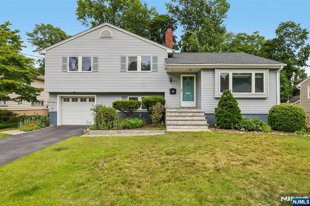 Welcome to this sunny and chic home nestled on one of Ridgewoodâ€™s rare cul-de-sacs, where youâ€™ll enjoy the best of both worldsâ€”a quiet, close-knit neighborhood setting just moments from the vibrant downtown. Thoughtfully designed with central ac, open-concept living and gleaming hardwood floors, this home offers versatile spaces for both everyday living and effortless entertaining. The spacious living room, anchored by a fireplace and oversized bay window, is filled with natural light and flows seamlessly into the dining room and kitchen. The grade-level family room connects effortlessly to the attached garage, newly renovated powder room, and laundry room, while a lower-level recreation room/office and separate expansive storage area provide exceptional flexibility. The bedroom wing features a primary ensuite, two additional bedrooms, and a large hall bath. With its large deck, serene backyard, peaceful cul de sac and central location, this gem is all about lifestyle