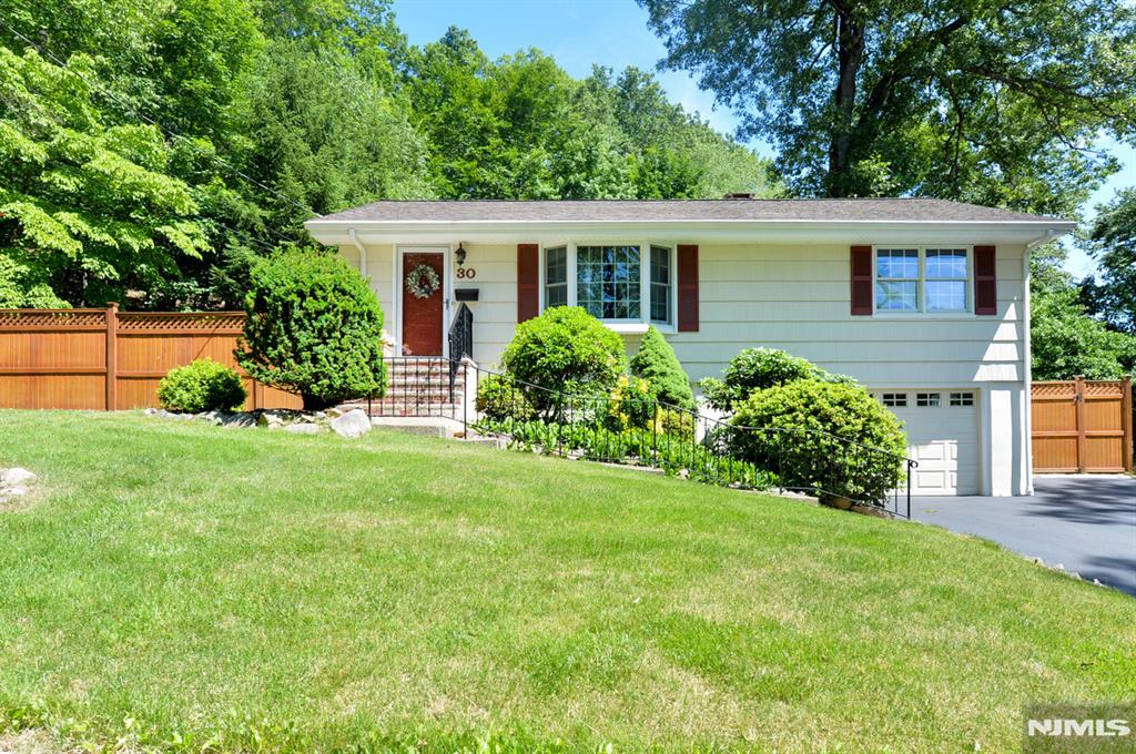 A beautifully maintained ranch style home nestled in a picturesque neighborhood. The updated kitchen features stainless steel appliances, granite countertops & beautiful wood cabinets. Kitchen opens to the dining room with sliders to the deck & the living room has a large bay window letting in plenty of natural light ,and offers a nice easy flow for everyday living and entertaining. Two generous sized bedrooms and a full bath complete the main level with hardwood floors through out. A Walk-out ground level expands your living space offering a spacious family room with a wood burning stove with a natural stone backing and. hearth surrounded by custom tilework. The additional full bath, a dedicated laundry room, & garage access make this both functional & welcoming. Step outside to your private backyard oasis, offering a heated pool, covered deck, fire pit, storage shed with covered awning and additional 2nd shed. Charming stone walls surrounded by lush, thoughtfully designed landscaping make this property perfect for relaxing or hosting gatherings. Upgrades include Newer Windows, Central Air, & an attractive Cedar Fence. This home is in absolute move in condition! This is one you have been waiting for!