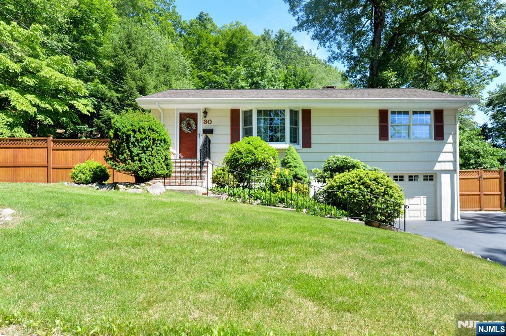 A beautifully maintained ranch style home nestled in a picturesque neighborhood. The updated kitchen features stainless steel appliances, granite countertops & beautiful wood cabinets. Kitchen opens to the dining room with sliders to the deck & the living room has a large bay window letting in plenty of natural light ,and offers a nice easy flow for everyday living and entertaining. Two generous sized bedrooms and a full bath complete the main level with hardwood floors through out. A Walk-out ground level expands your living space offering a spacious family room with a wood burning stove with a natural stone backing and. hearth surrounded by custom tilework. The additional full bath, a dedicated laundry room, & garage access make this both functional & welcoming. Step outside to your private backyard oasis, offering a heated pool, covered deck, fire pit, storage shed with covered awning and additional 2nd shed. Charming stone walls surrounded by lush, thoughtfully designed landscaping make this property perfect for relaxing or hosting gatherings. Upgrades include Newer Windows, Central Air, & an attractive Cedar Fence. This home is in absolute move in condition! This is one you have been waiting for!