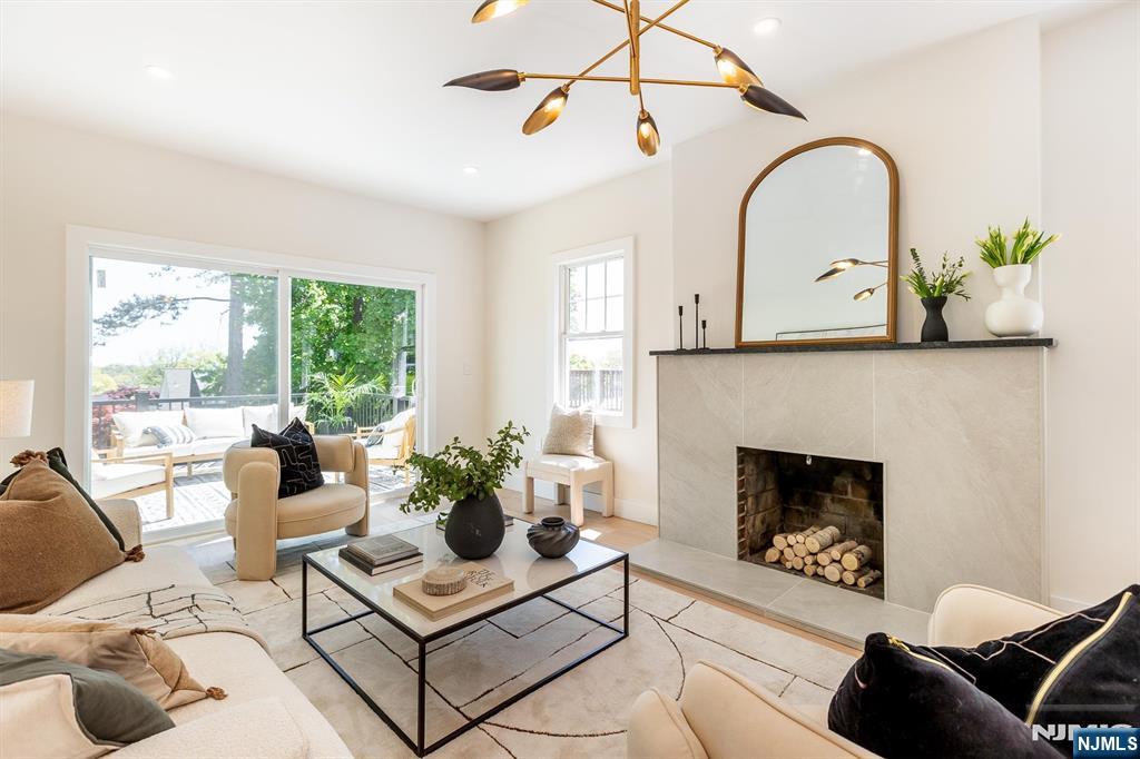 Keep the city energy, just add breathing room. Filled with natural light and thoughtfully redesigned throughout, 4 Yale Terrace combines sophisticated finishes, exceptional outdoor living, and a prime location in the Gregory neighborhood. Multiple spaces for gathering - from the welcoming front porch to the elevated deck, lower patio, and oversized backyard - create a home equally suited for entertaining, relaxation, and everyday living. This professionally redesigned home has been extensively rebuilt with all major systems replaced, including a new roof, making it truly move-in ready. Inside, curated materials and thoughtful design choices deliver a level of sophistication rarely found in comparable renovations. At the heart of the home, a beautifully designed kitchen combines refined materials and warm finishes, curated lighting, sleek surfaces, and thoughtful craftsmanship, creating a stunning yet welcoming space that naturally draws people in and invites them to linger. The primary suite features a spa-inspired bath, while a spacious, sun-filled 3rd-floor bedroom offers flexibility as a home office, studio, or future en-suite, delivering the comfort and privacy of a retreat within the home. Located near parks, dining, shopping, and NYC transportation, 4 Yale Terrace offers the rare mixture of thoughtful design, natural light, outdoor living, and a design sensibility that transforms a meticulously redesigned house into a place that truly feels like home.