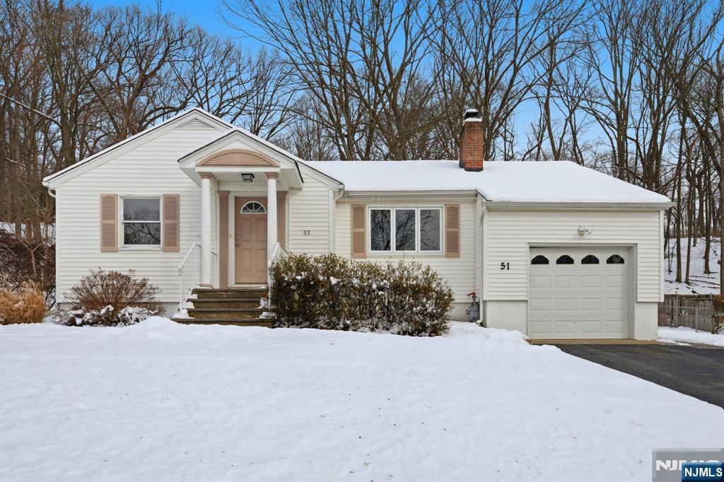 Welcome home to this inviting 2-bedroom ranch tucked into a quiet West Dover neighborhood, perfectly positioned near the Randolph border. Just minutes from Hedden Park, a beloved local gem offering walking trails, athletic fields, playgrounds, and open green space.. this home blends comfort, character, and convenience. Easy access to all major highways, commuting is a breeze, including NYC-direct service from the Dover train station. Inside, the sun-filled living room welcomes you with a cozy wood-burning fireplace and beautiful hardwood floors, flowing effortlessly into a comfortable open dining combination. The kitchen features a stainless steel oven/range and a convenient side entrance. A spacious office with built-ins provides the perfect work-from-home or creative space or third berm! The primary bedroom includes its own full bath with a stall shower, while the second bedroom and second full bathroom adds delightful retro charm with a pink tub and ceramic tile. Enjoy relaxing in the sunroom, fenced backyard & patio ideal for entertaining, gardening, or unwinding outdoors. Additional features include a one-car garage, plenty of parking, a full unfinished basement with laundry hookup and working toilet, plus a walk-up attic offering an abundance of storage. Close to DWTN Dover's shops, dining, & community events, this charming home offers a wonderful opportunity to enjoy both peaceful living and everyday convenience.