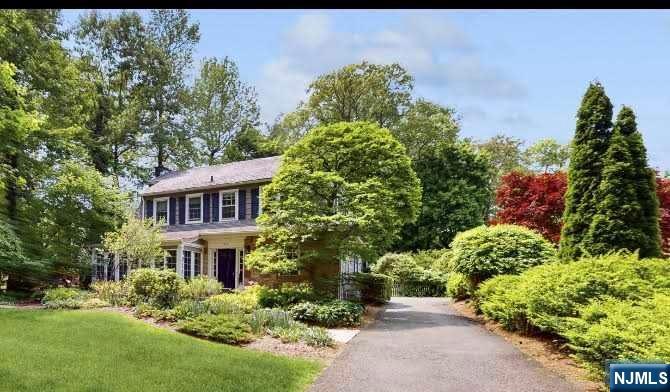 Never been offered... Charming East Hill Colonial with 4 bedrooms and 2.5 Baths. Features: Gracious Foyer, Front to back Living rm w/ Fireplace, Formal Dining rm and an all glass sun room, to admire the manicured landscaping.. The Eat-in kitchen was updated in 2006 and is conveniently located by the 2 car garage. All 4 bedrooms are on the 2nd floor. A bedroom suite with update Bath and 3 additional bedrooms with an updated main full bath complete this floor. Highlights: Private backyard filled with beautiful specimens, Slate roof, Some newer Anderson windows, All Hardwood Floors, Sprinklers, Stone Patio and a 8ft deer fence. Close to Houses of Worship, School, Shopping and NYC Transportation. Do not miss!
